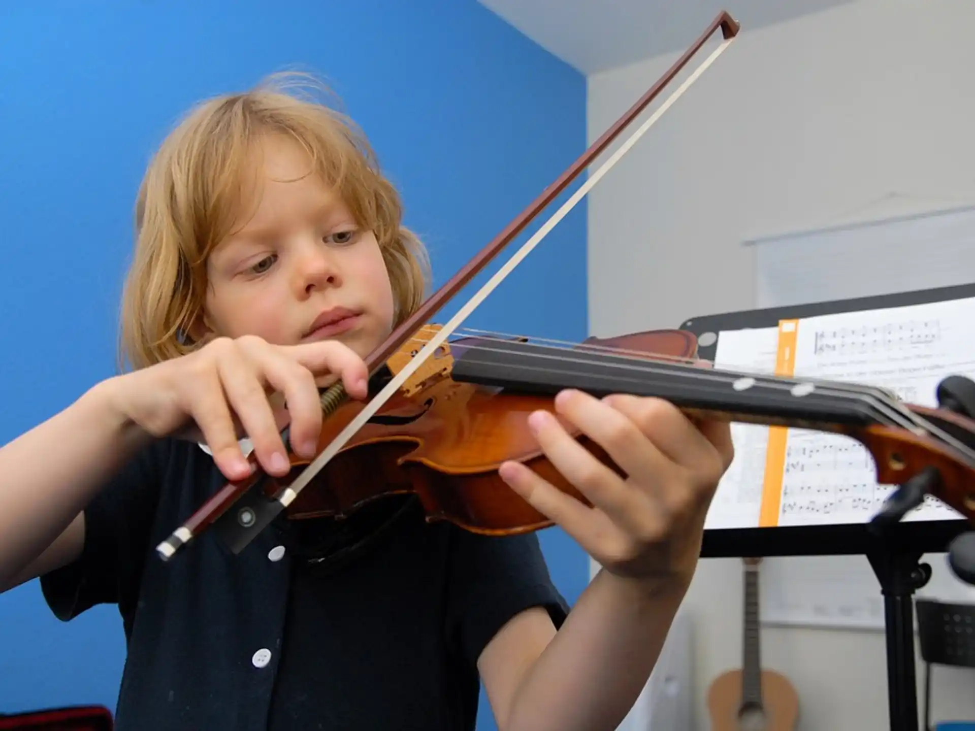 a girl playing a violin