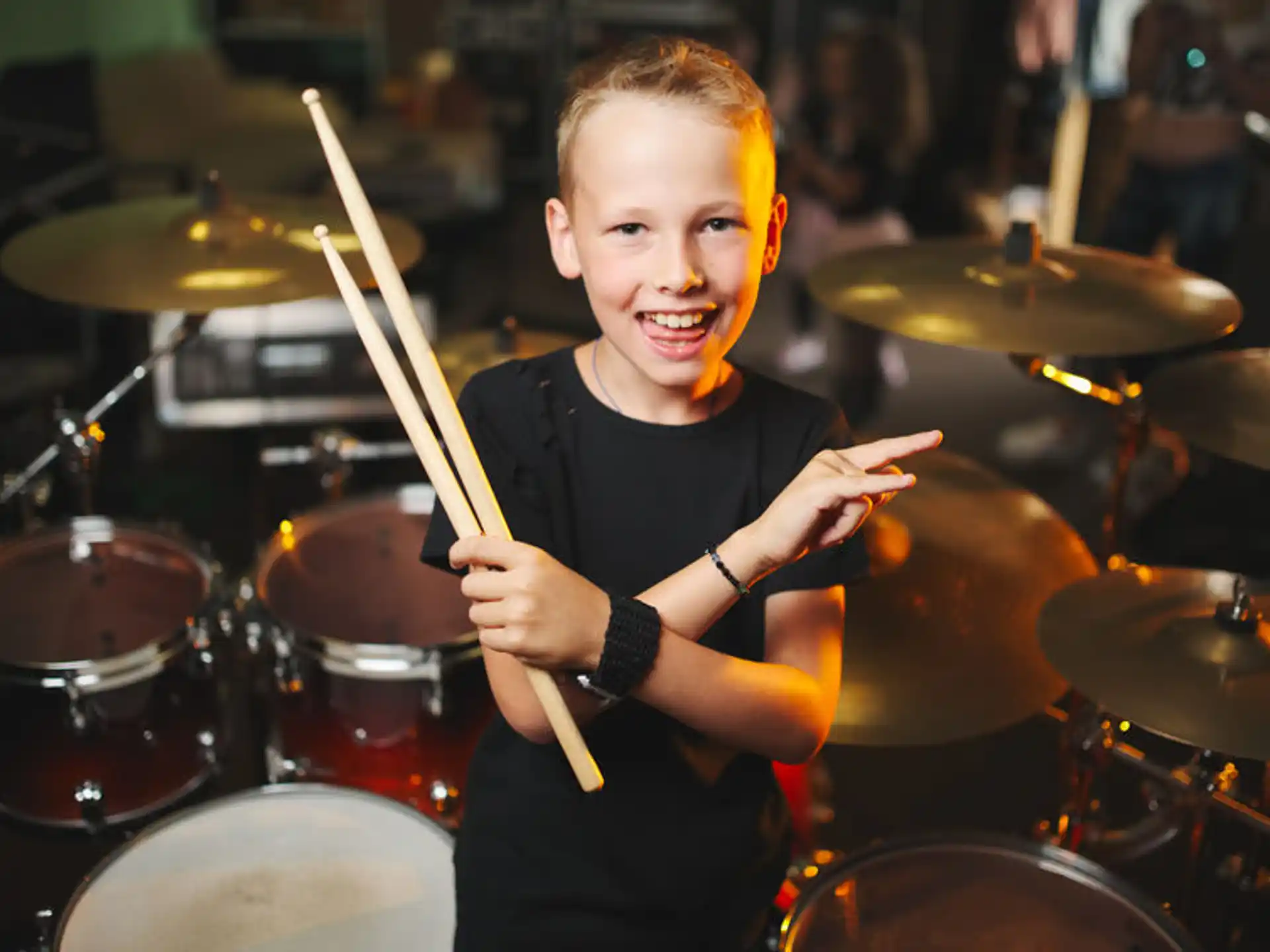 a boy playing drums