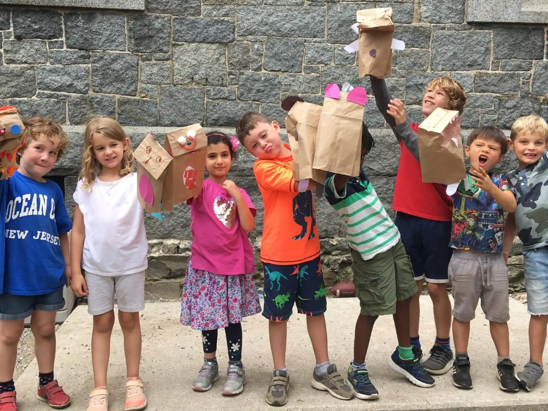 a group of children holding boxes