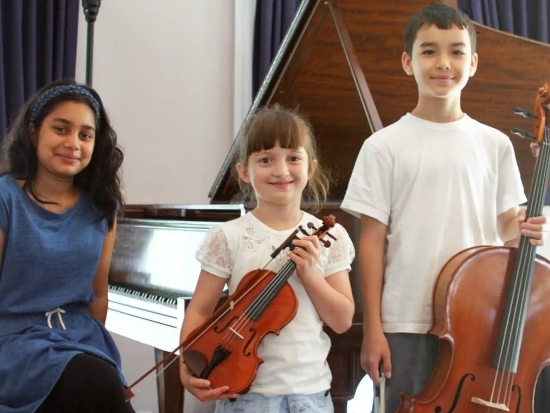 a group of kids holding musical instruments