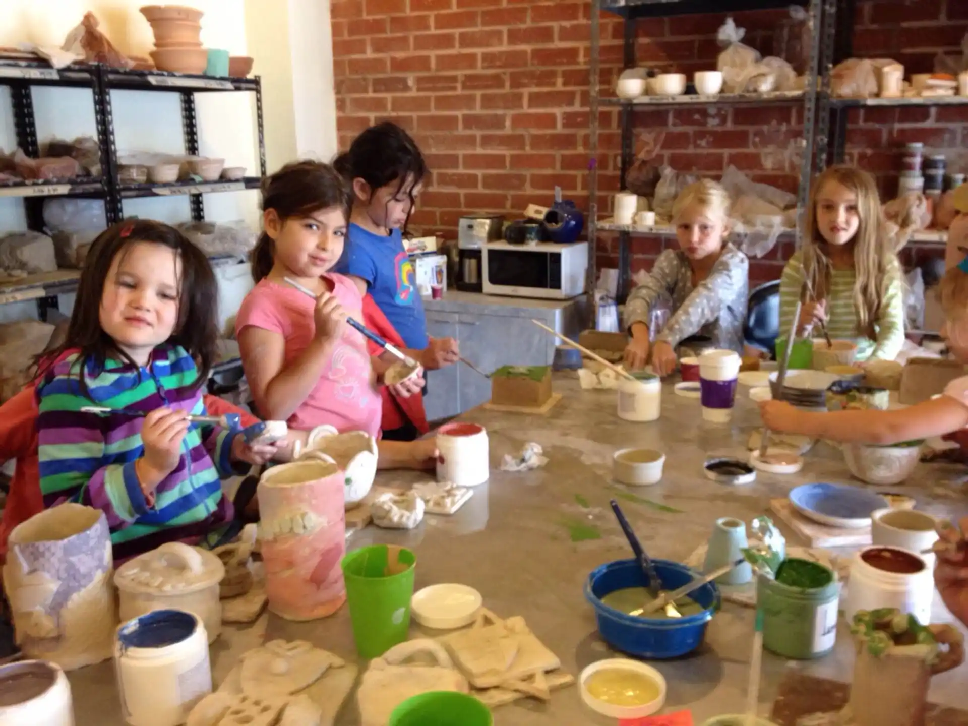a group of children painting