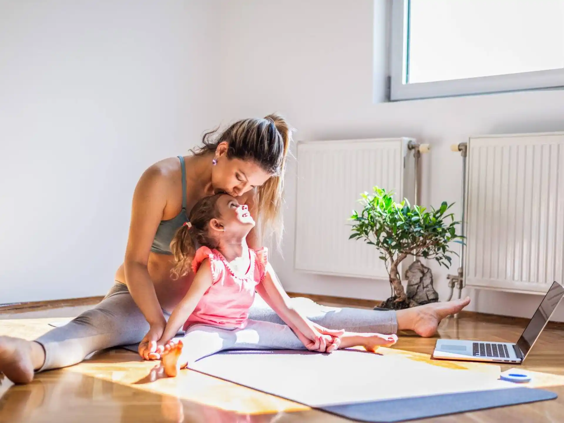 a person and a child sitting on the floor