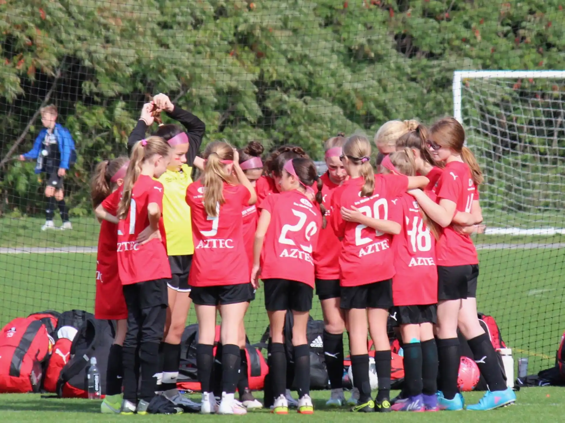 a group of girls in a football field