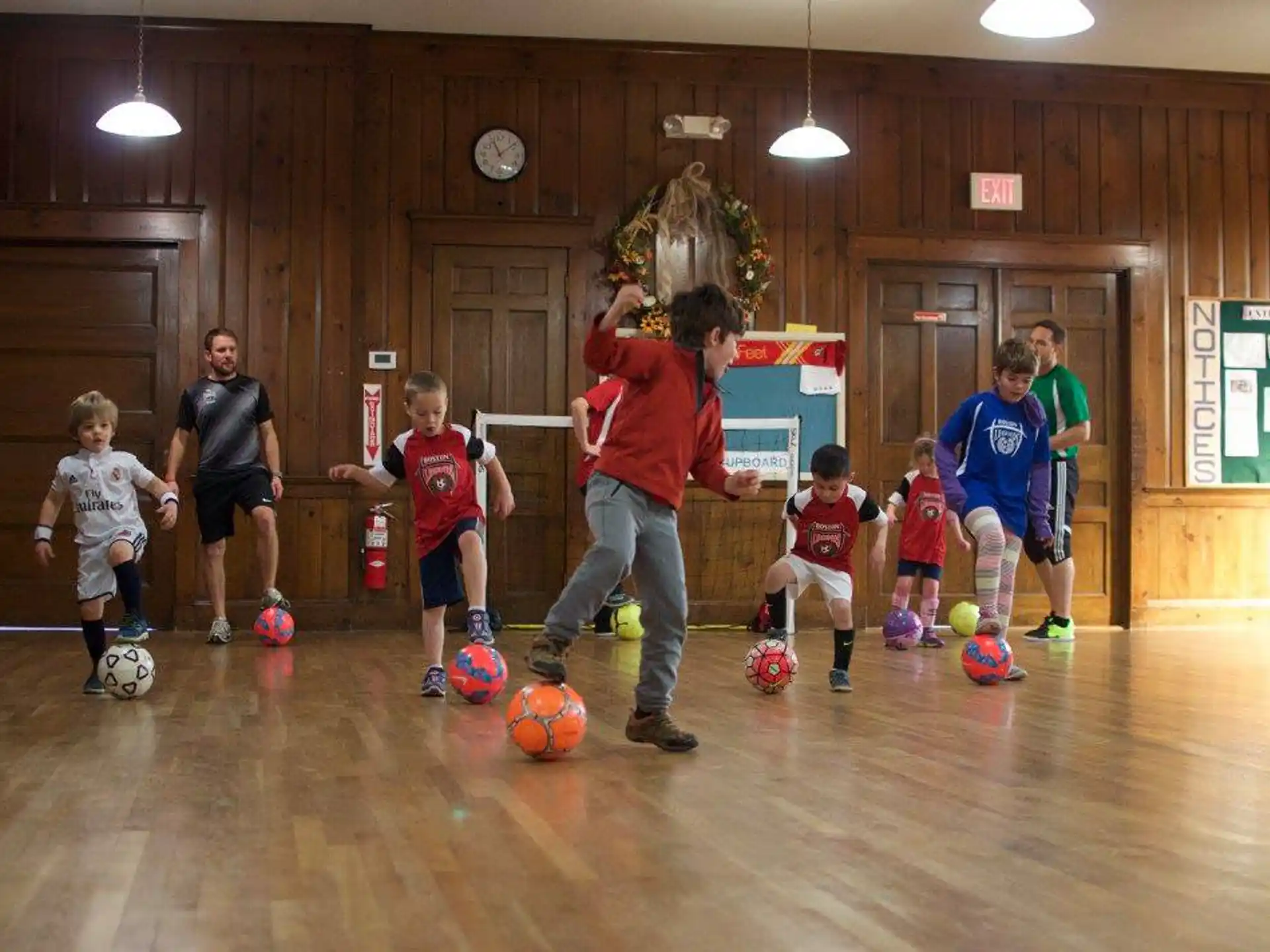 a group of kids playing football