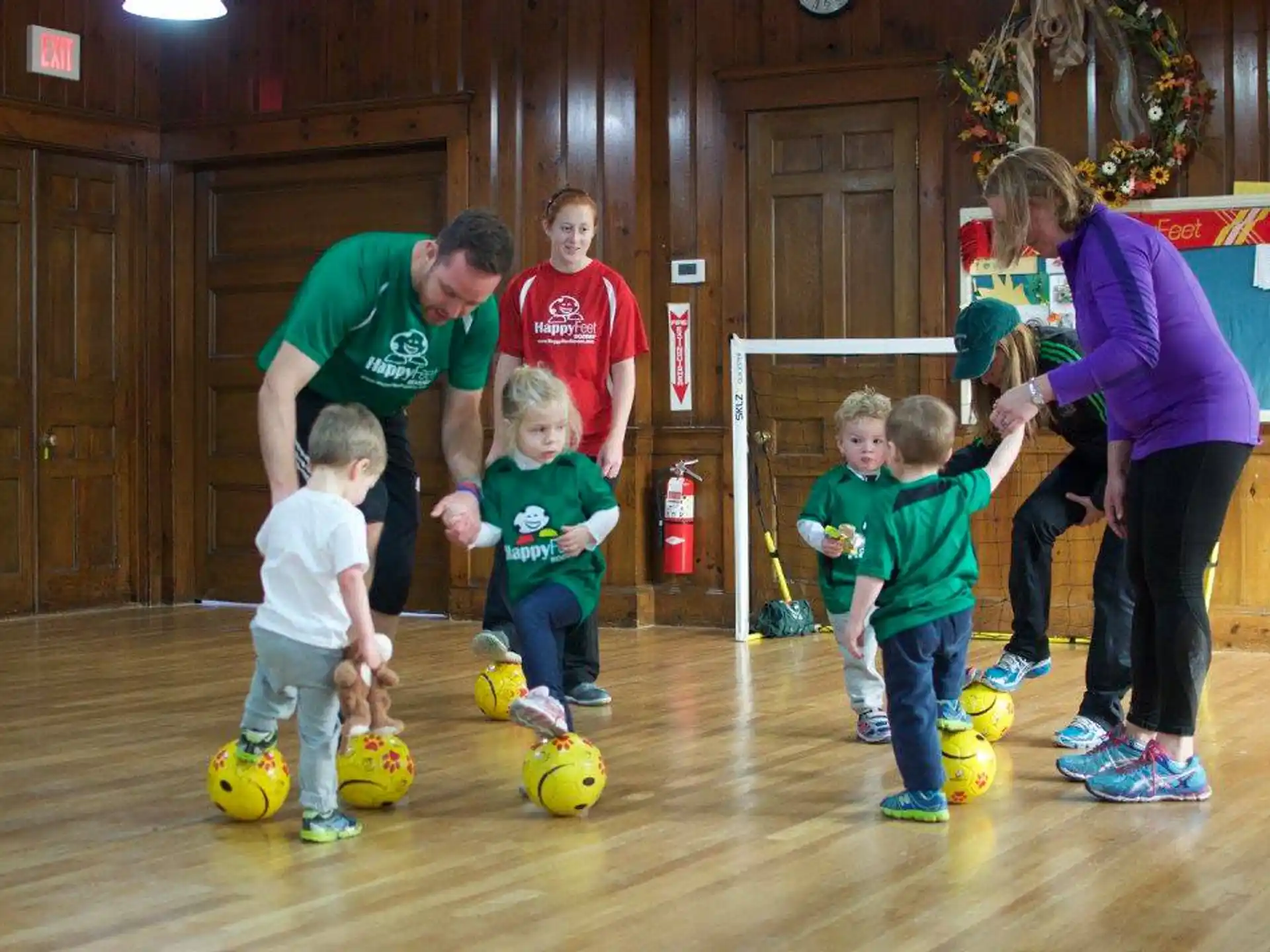a group of people playing with balls