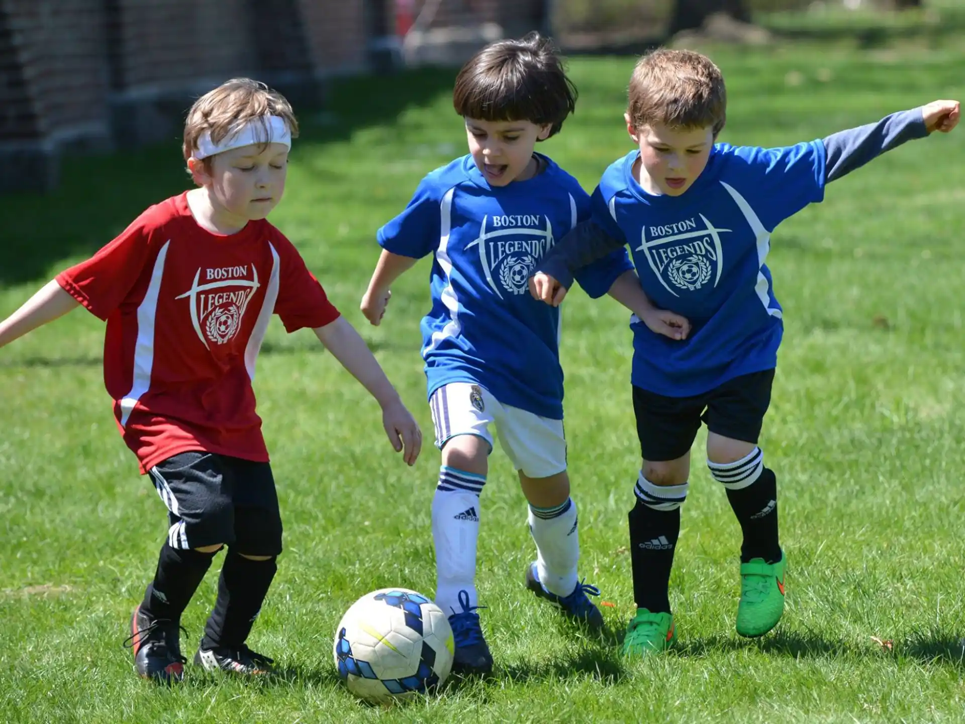 kids playing football on a field
