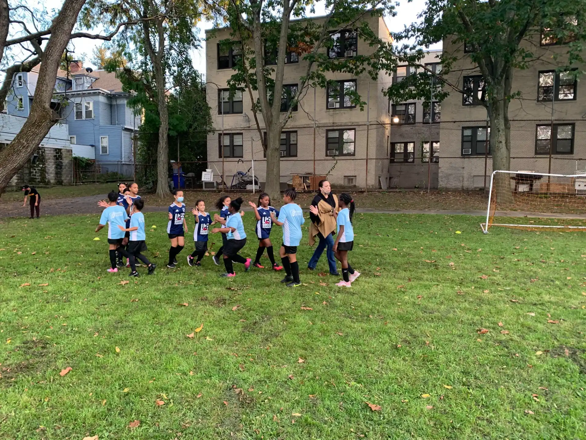 a group of kids playing football