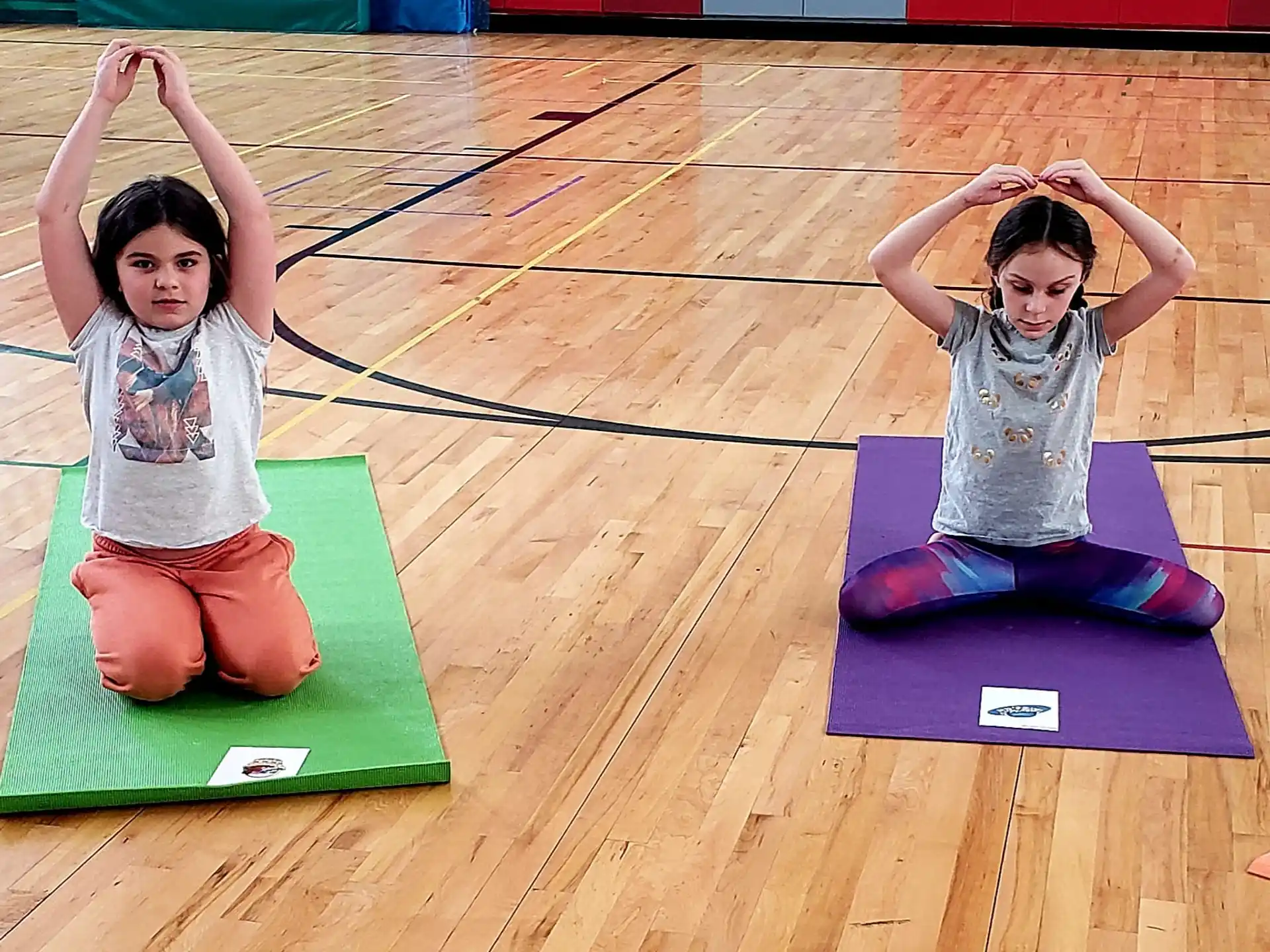 a couple of girls on mats