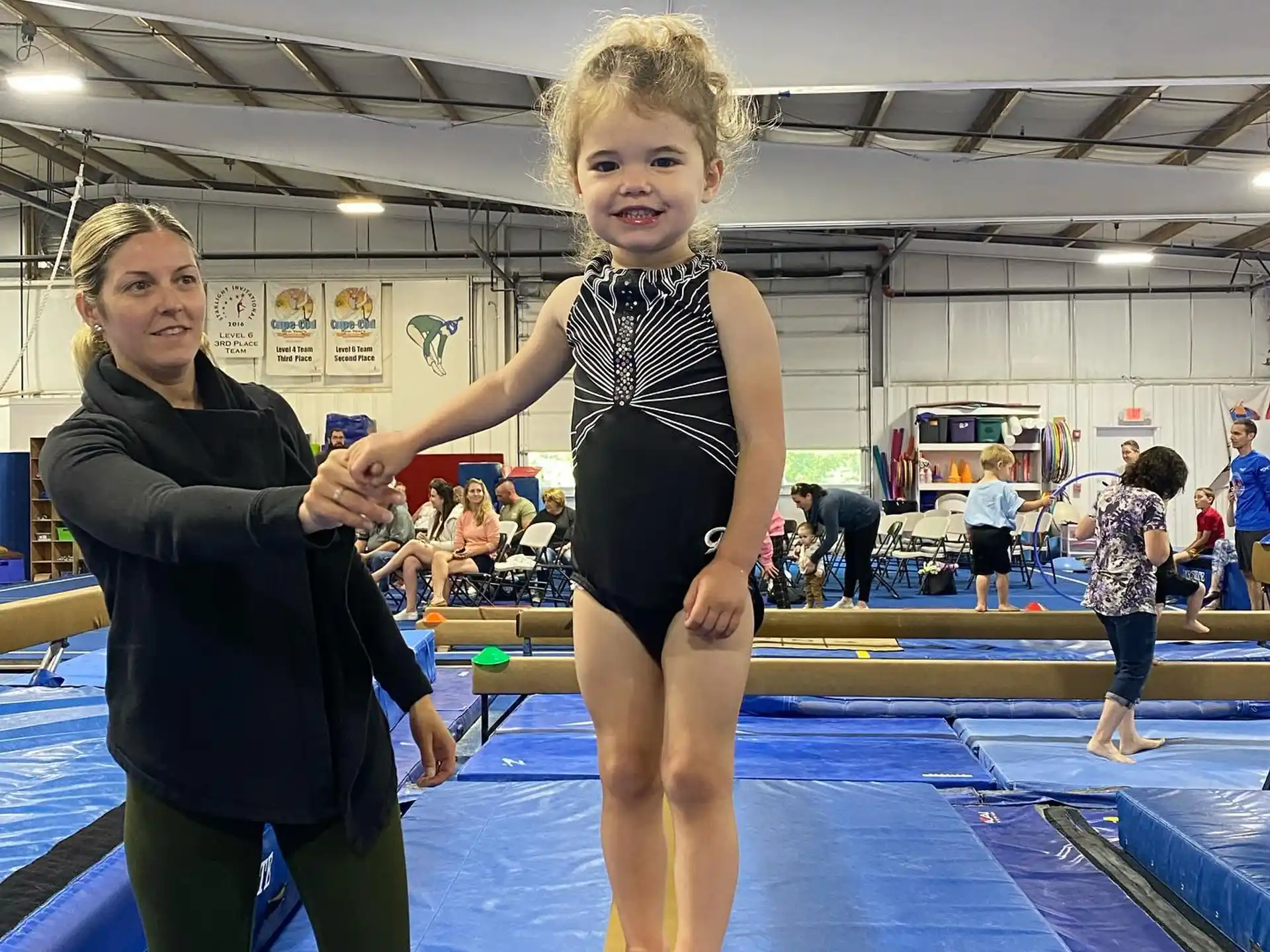 a person and a child in a gym
