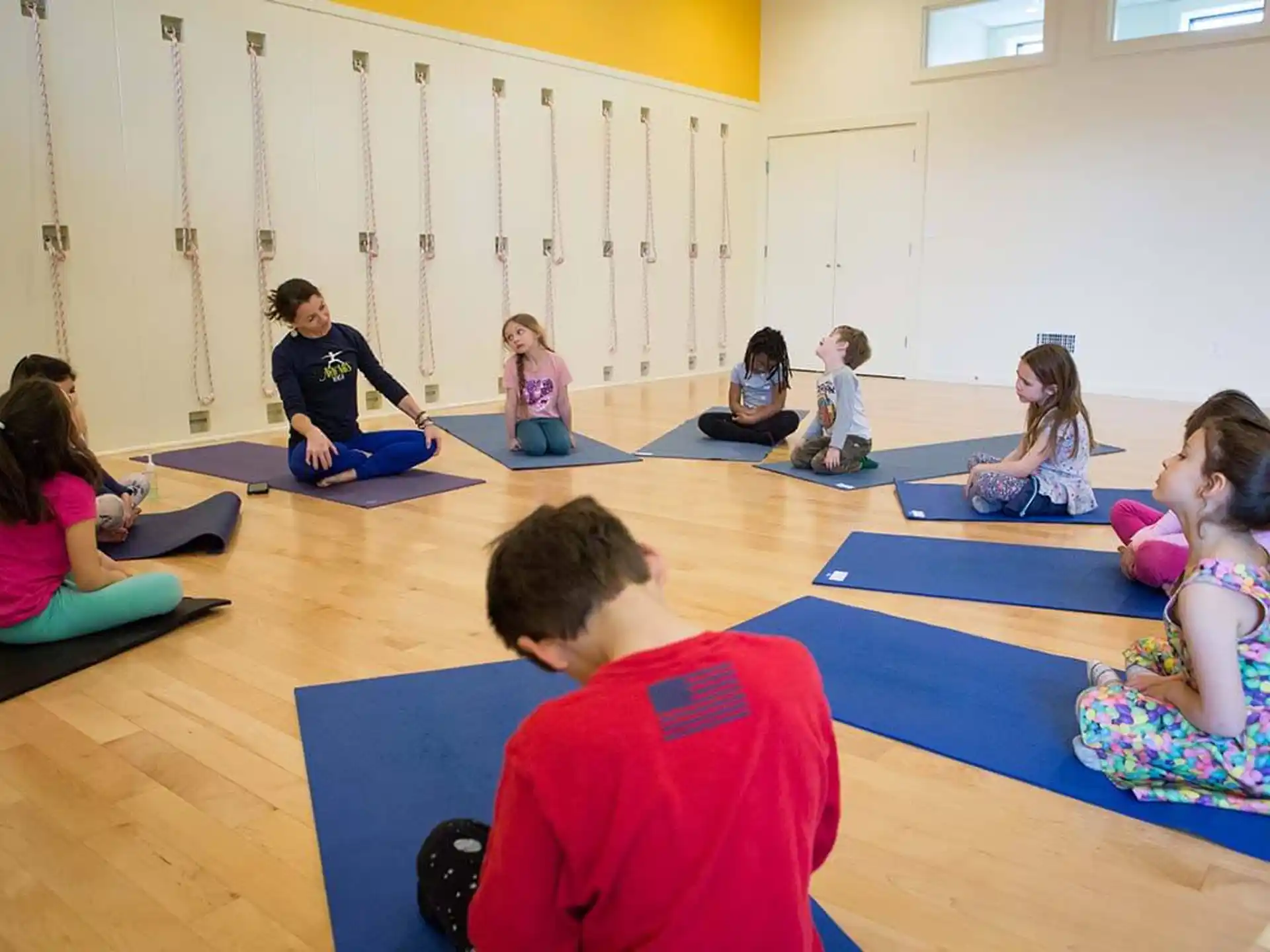a group of children sitting on the floor