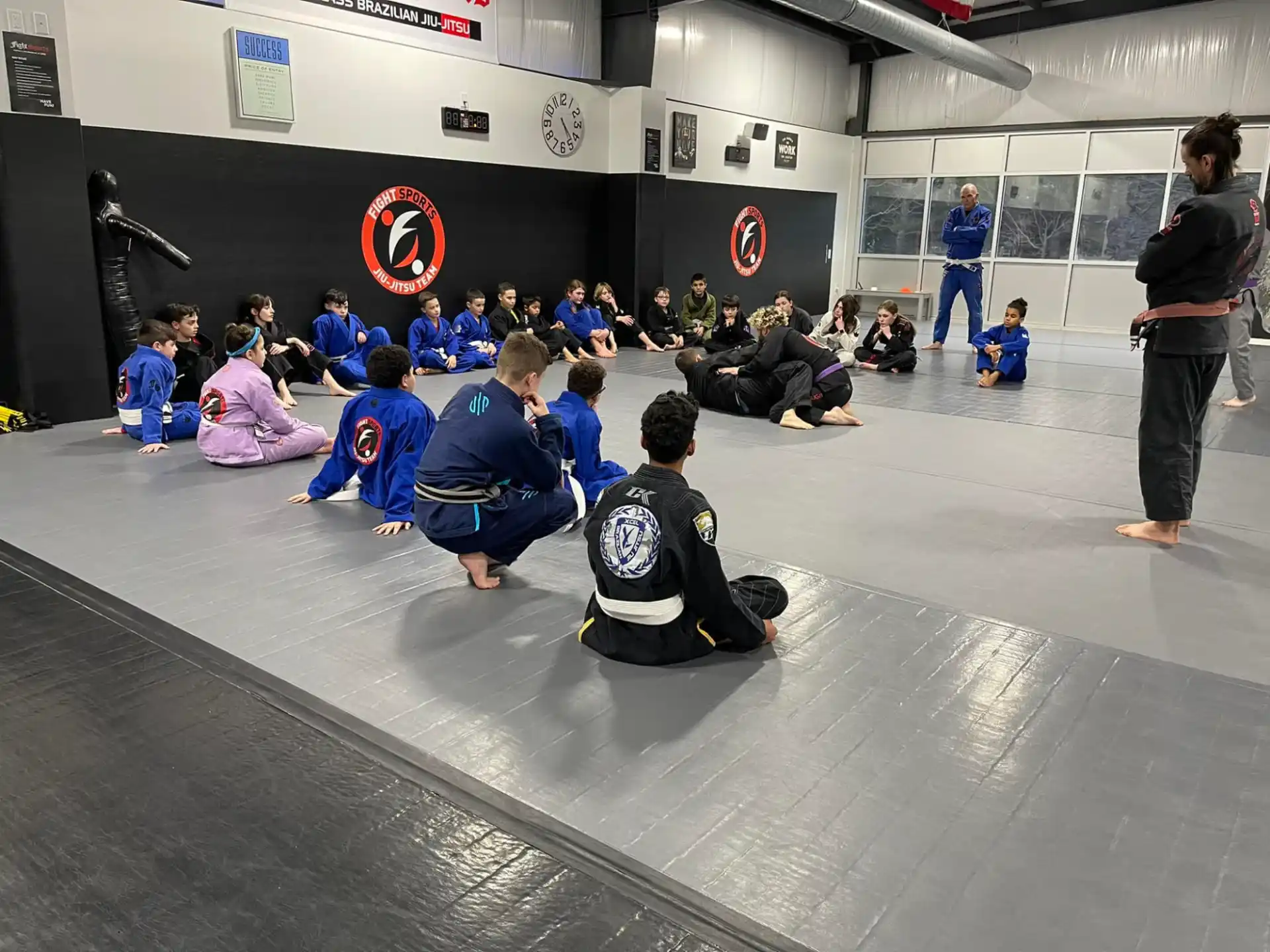 a group of people sitting on the floor