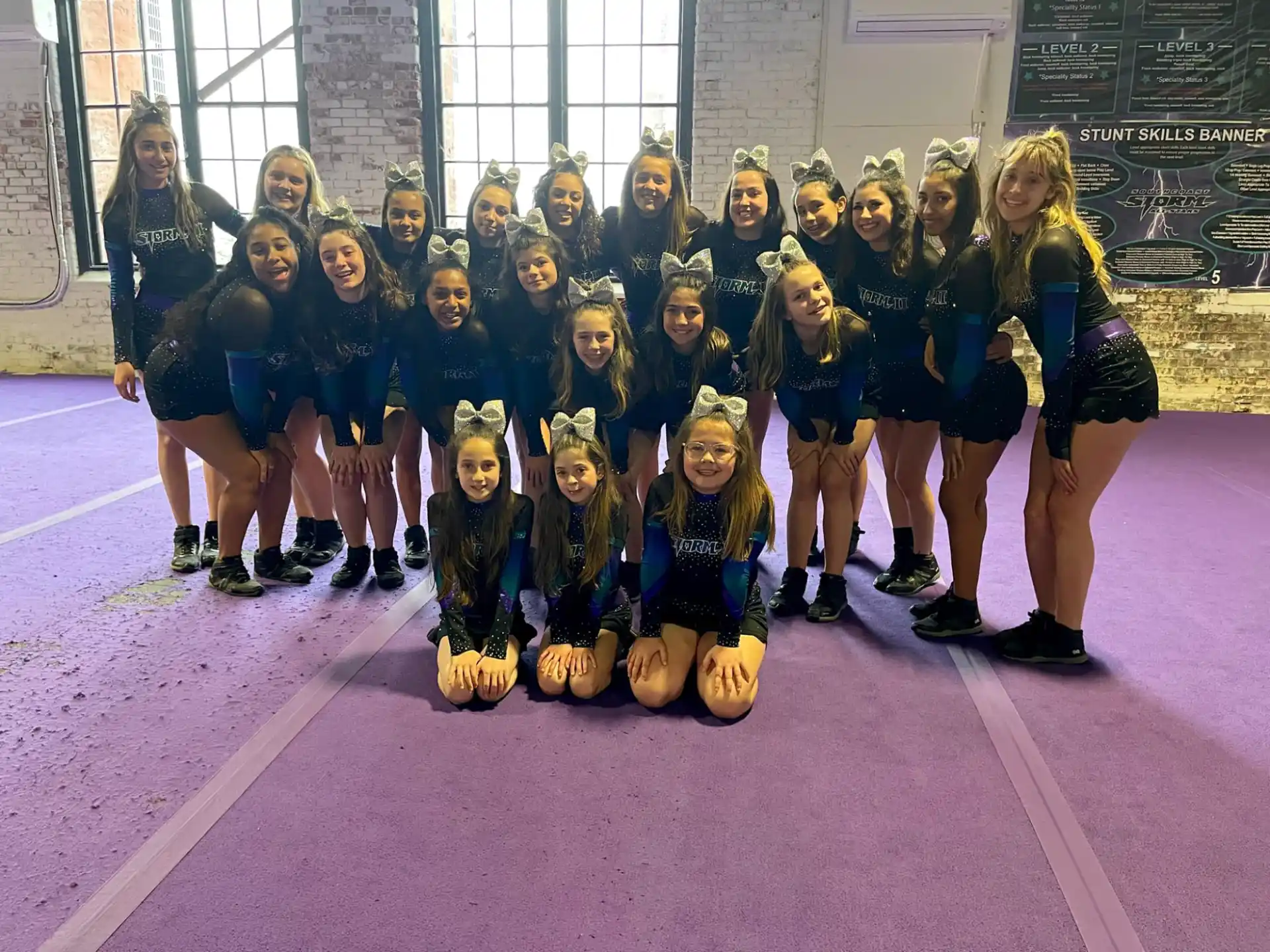 a group of girls posing for a photo