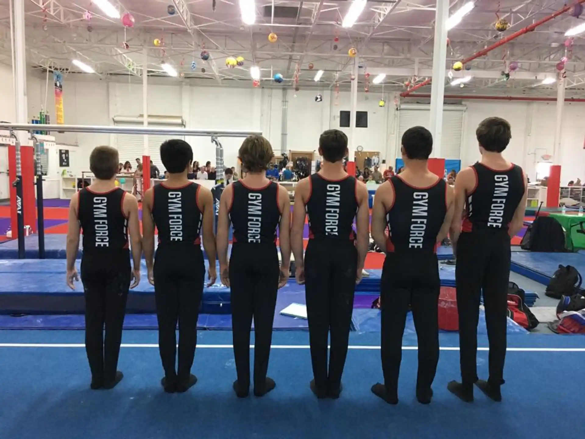 a group of people in a gym