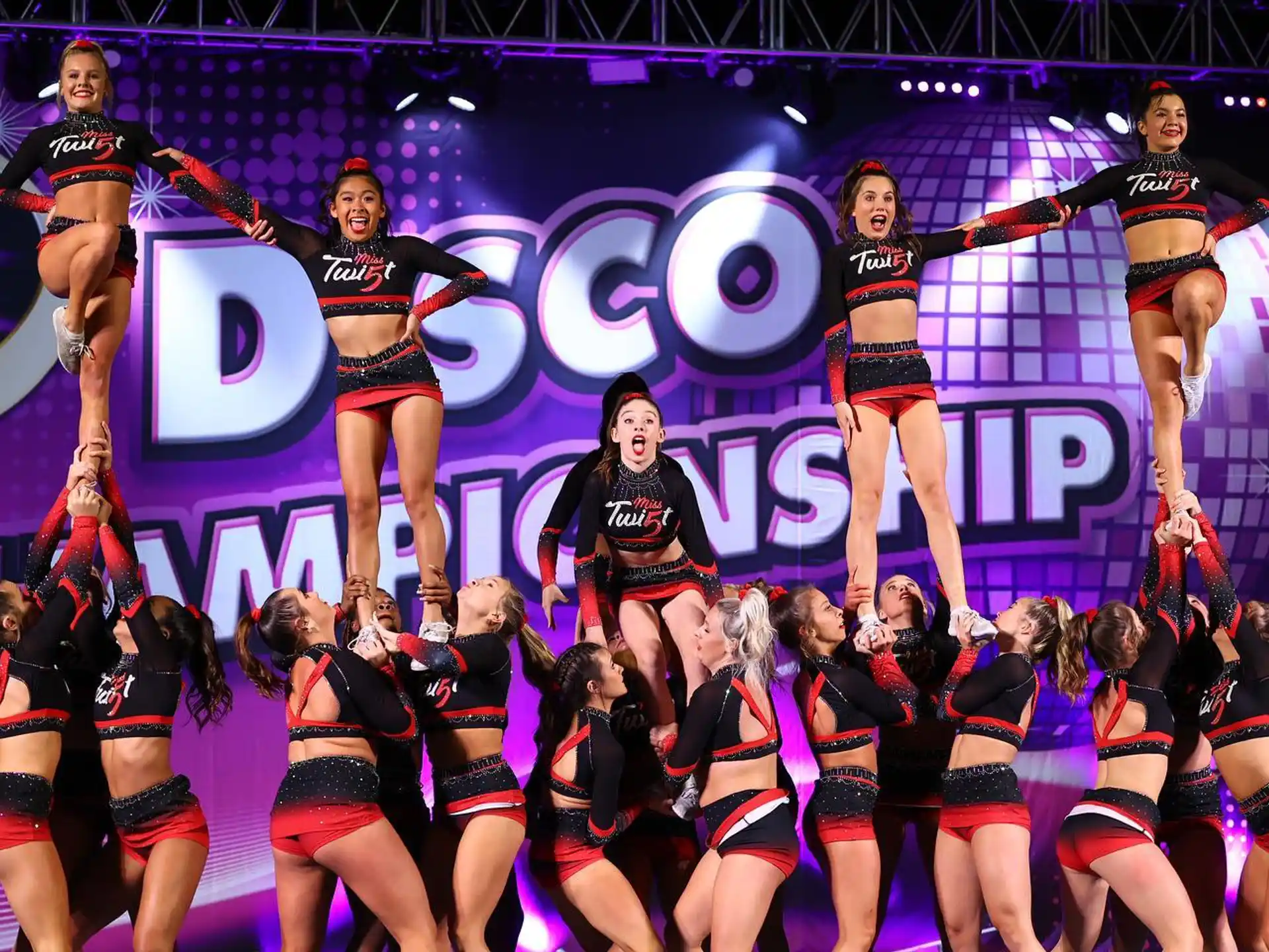 a group of cheerleaders on a stage