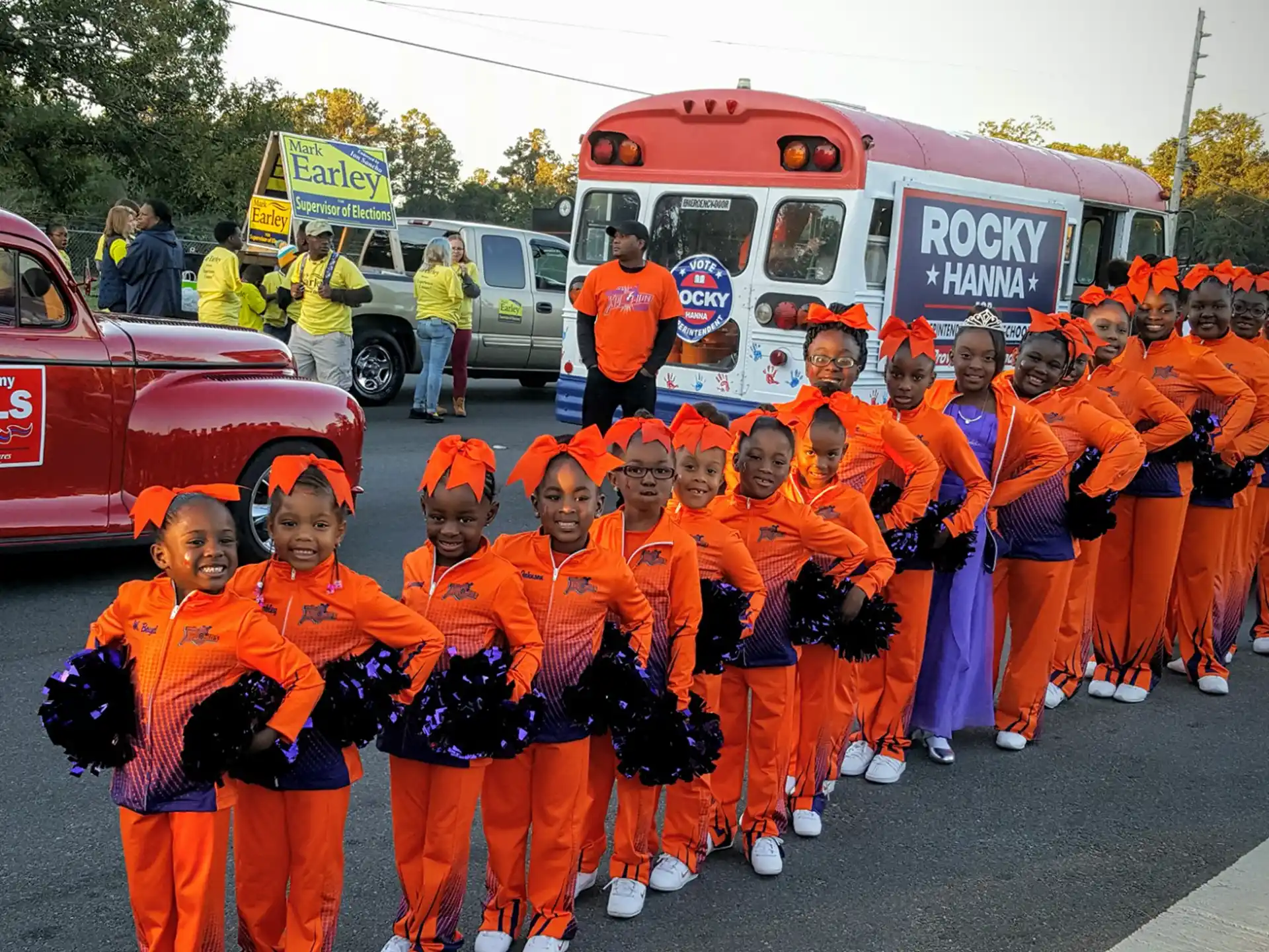 a group of people in orange jumpsuits