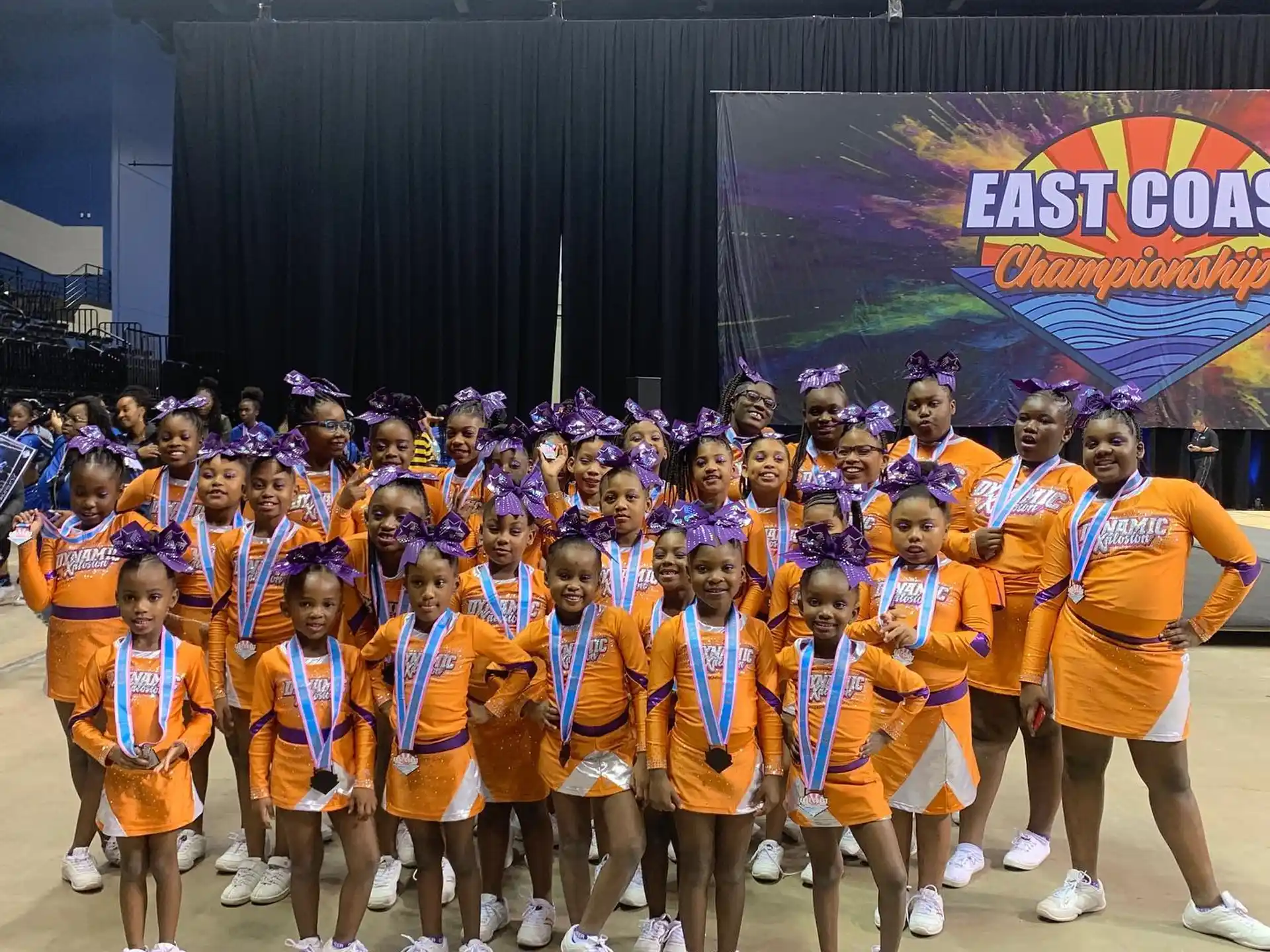 a group of people in orange uniforms