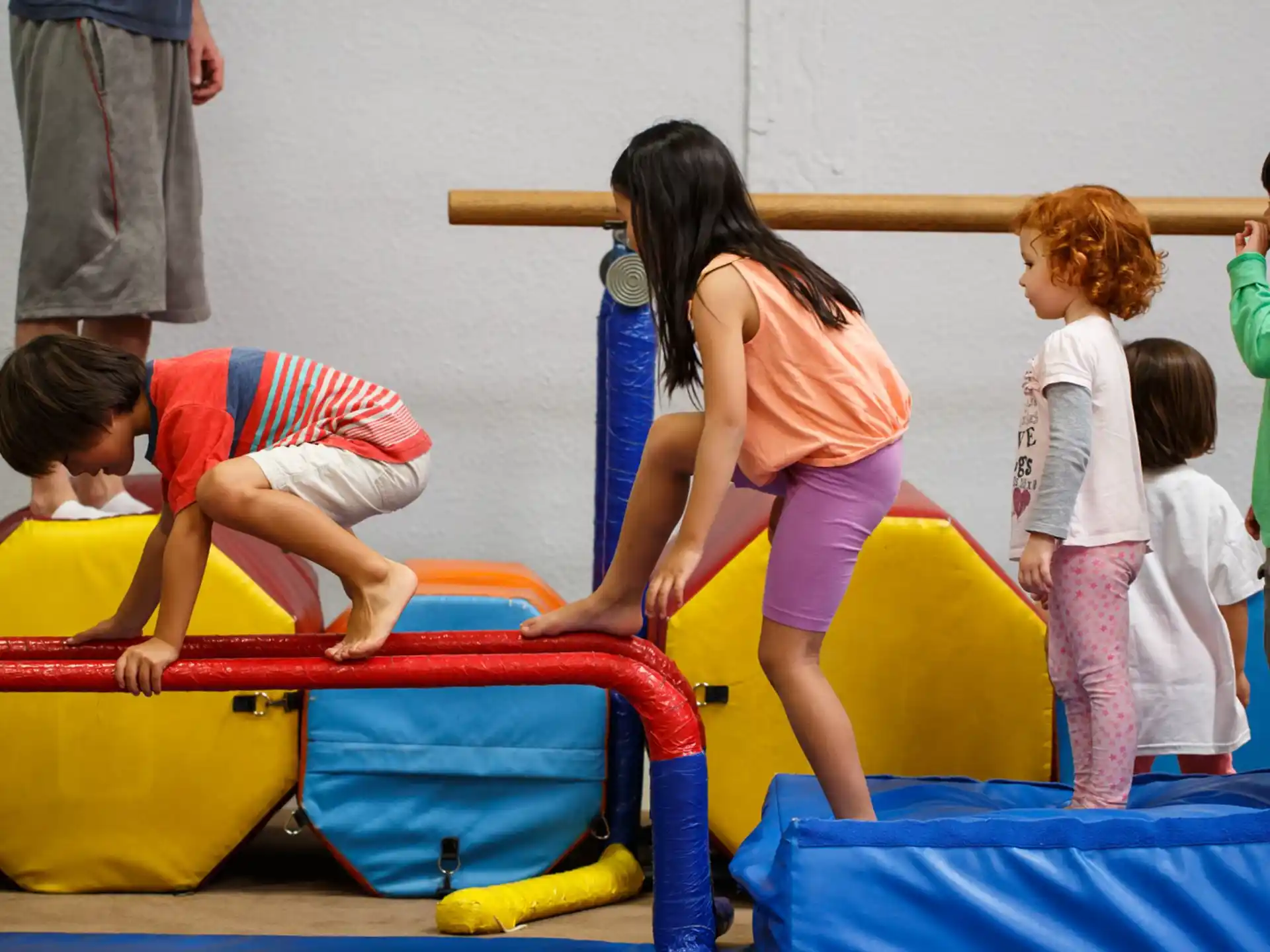a group of children playing on a trampoline