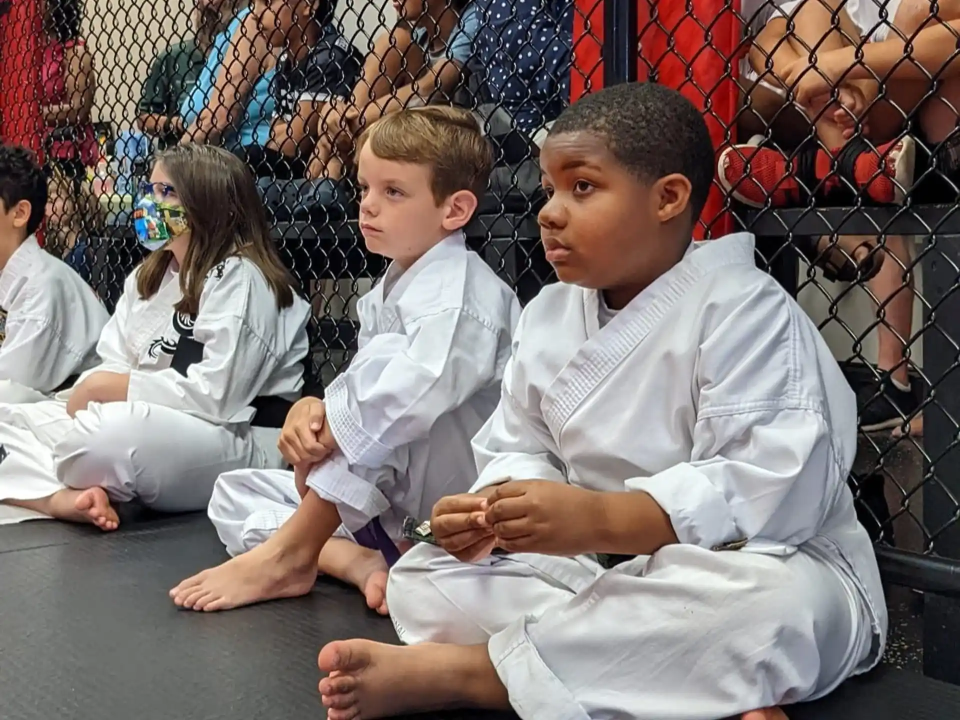 a group of children sitting on the floor