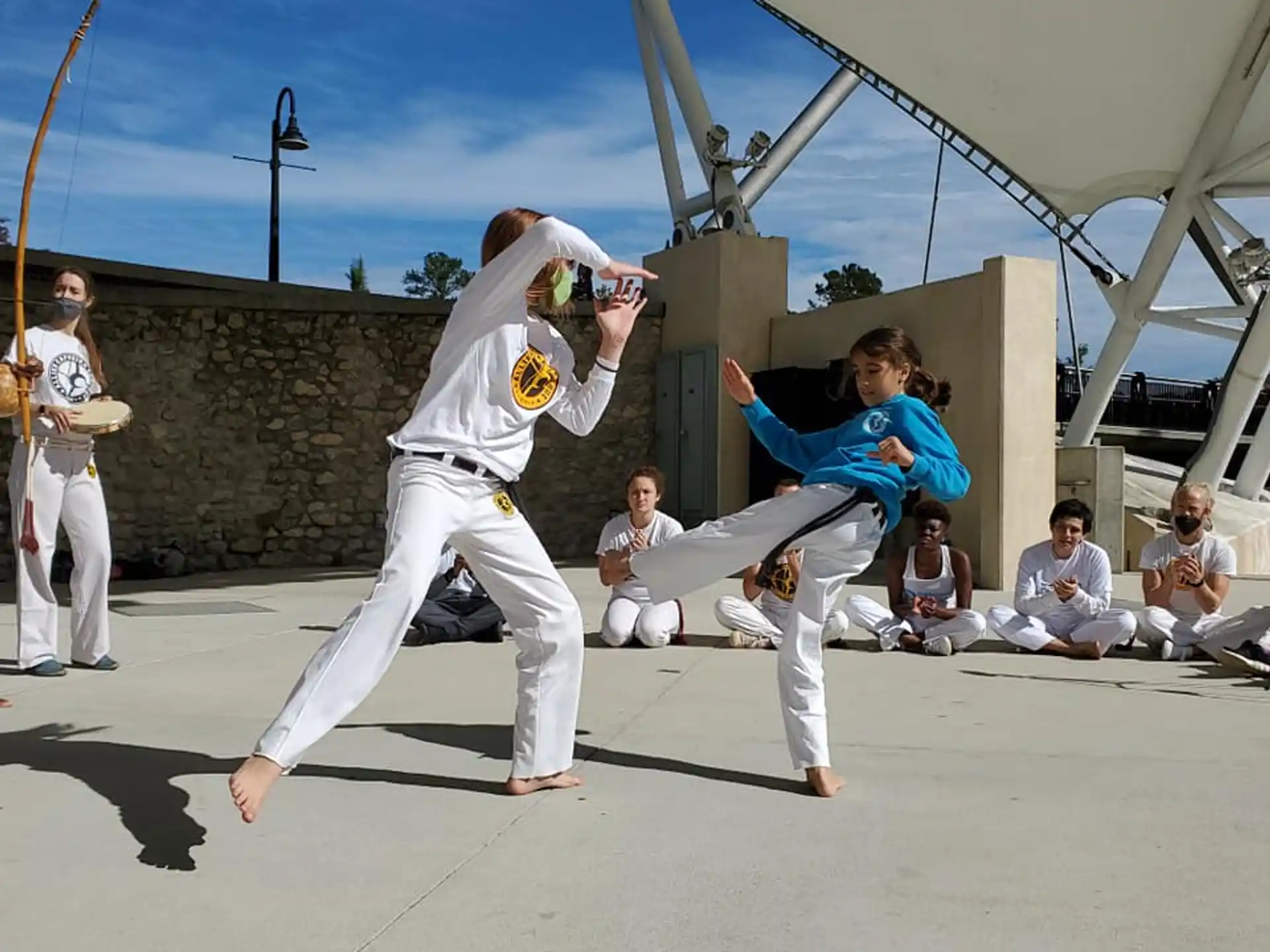 a group of people in karate uniforms