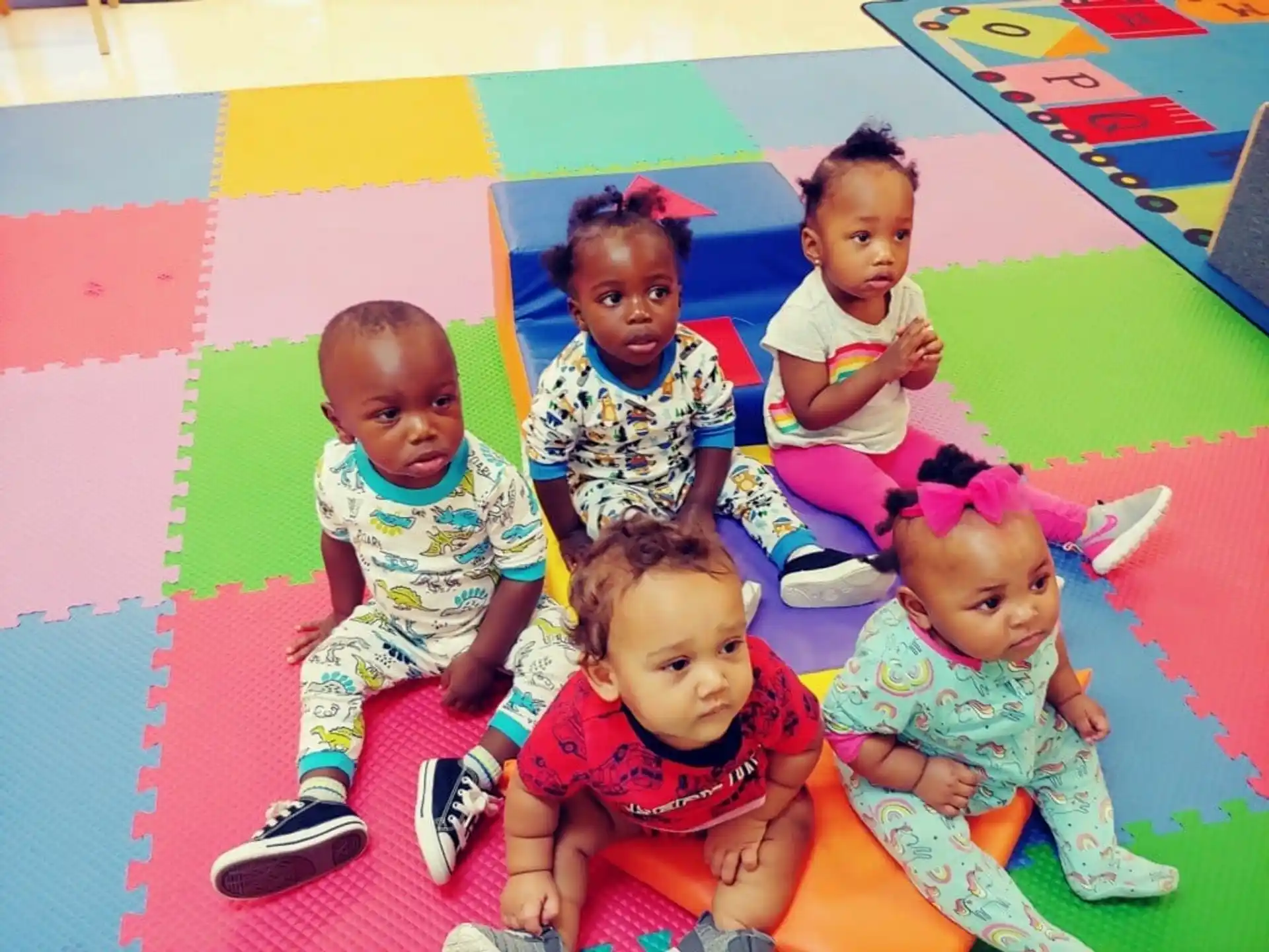 a group of children sitting on the floor