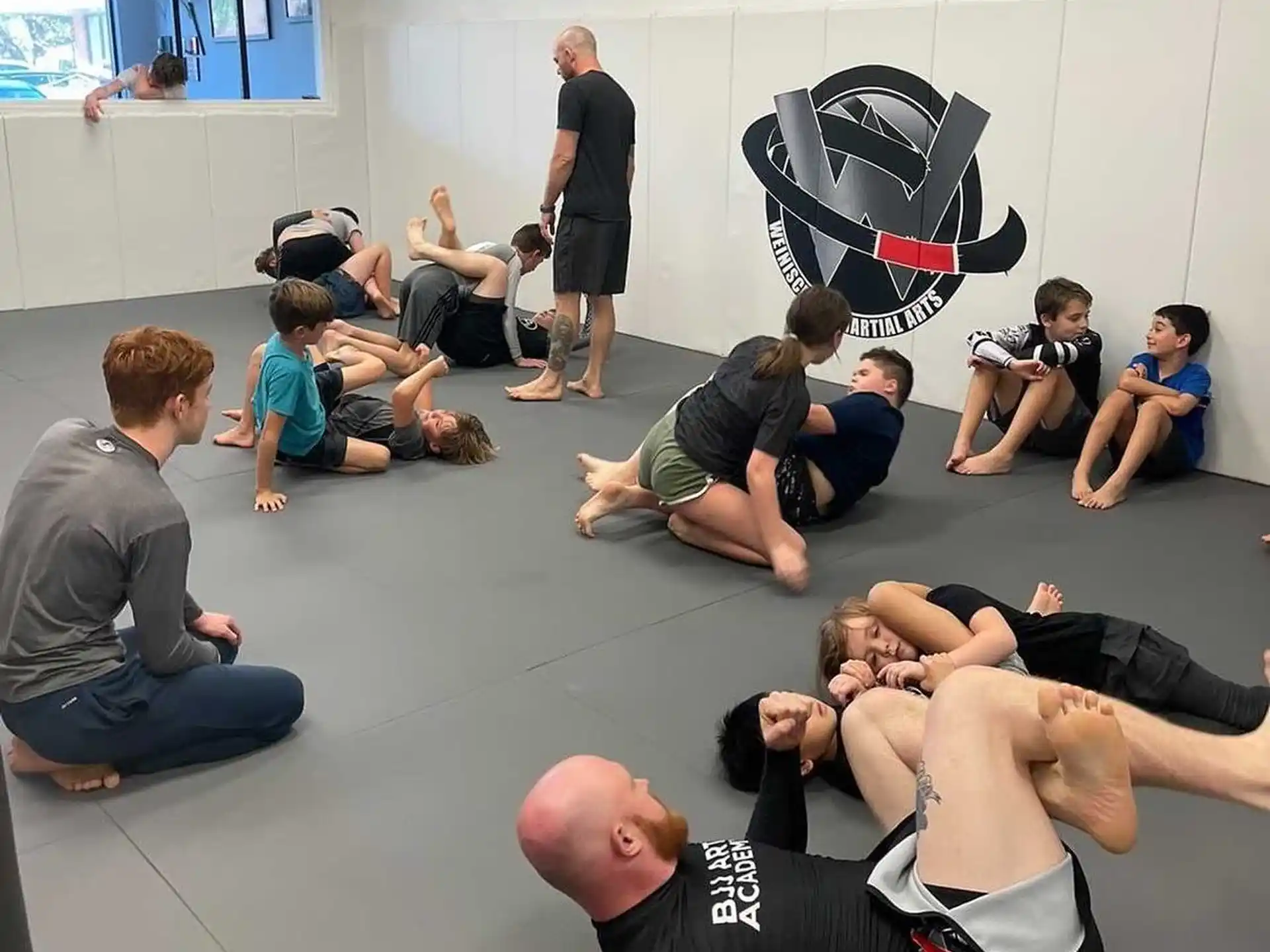 a group of people sitting on the floor