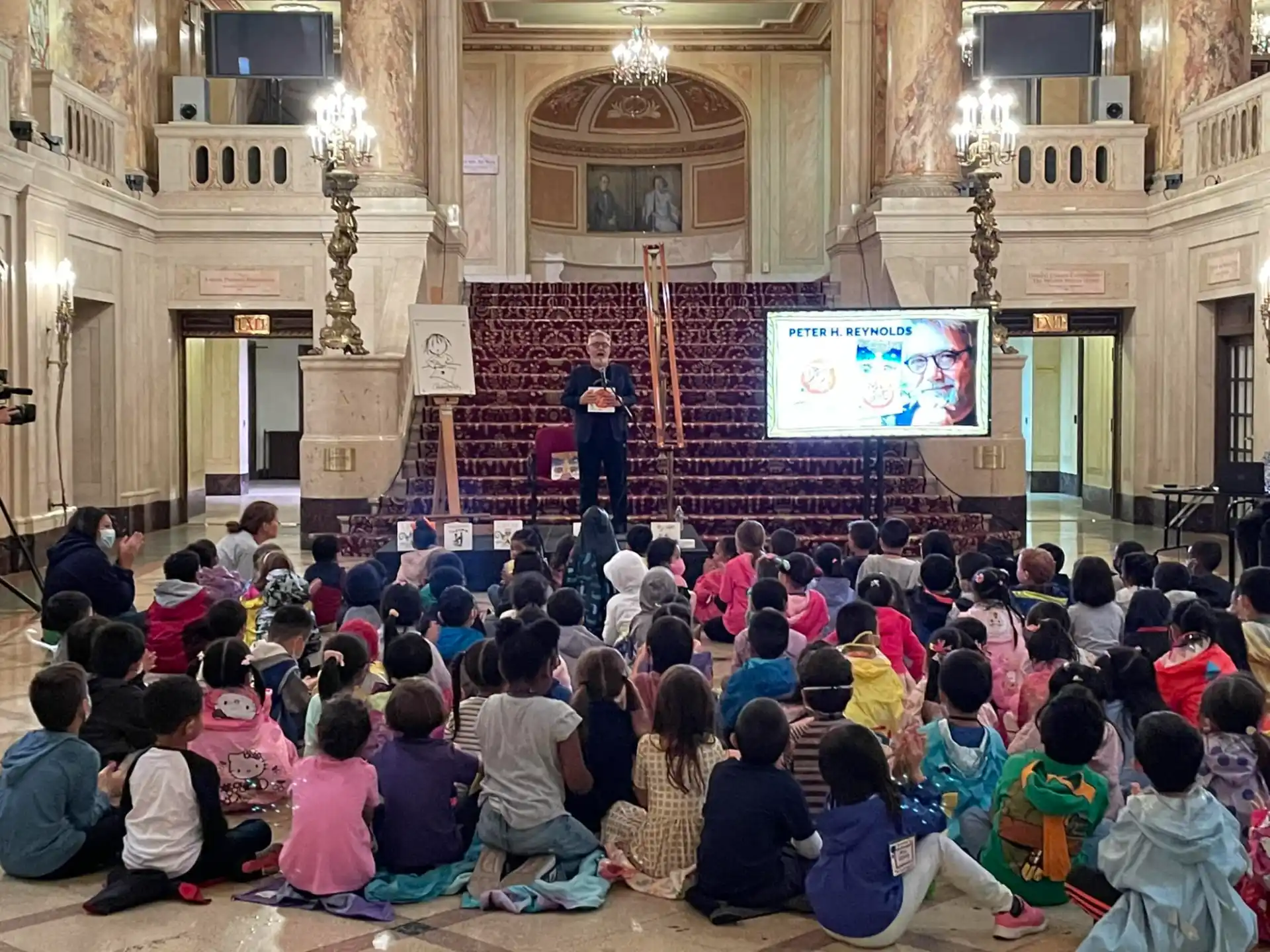a person giving a presentation to a group of people