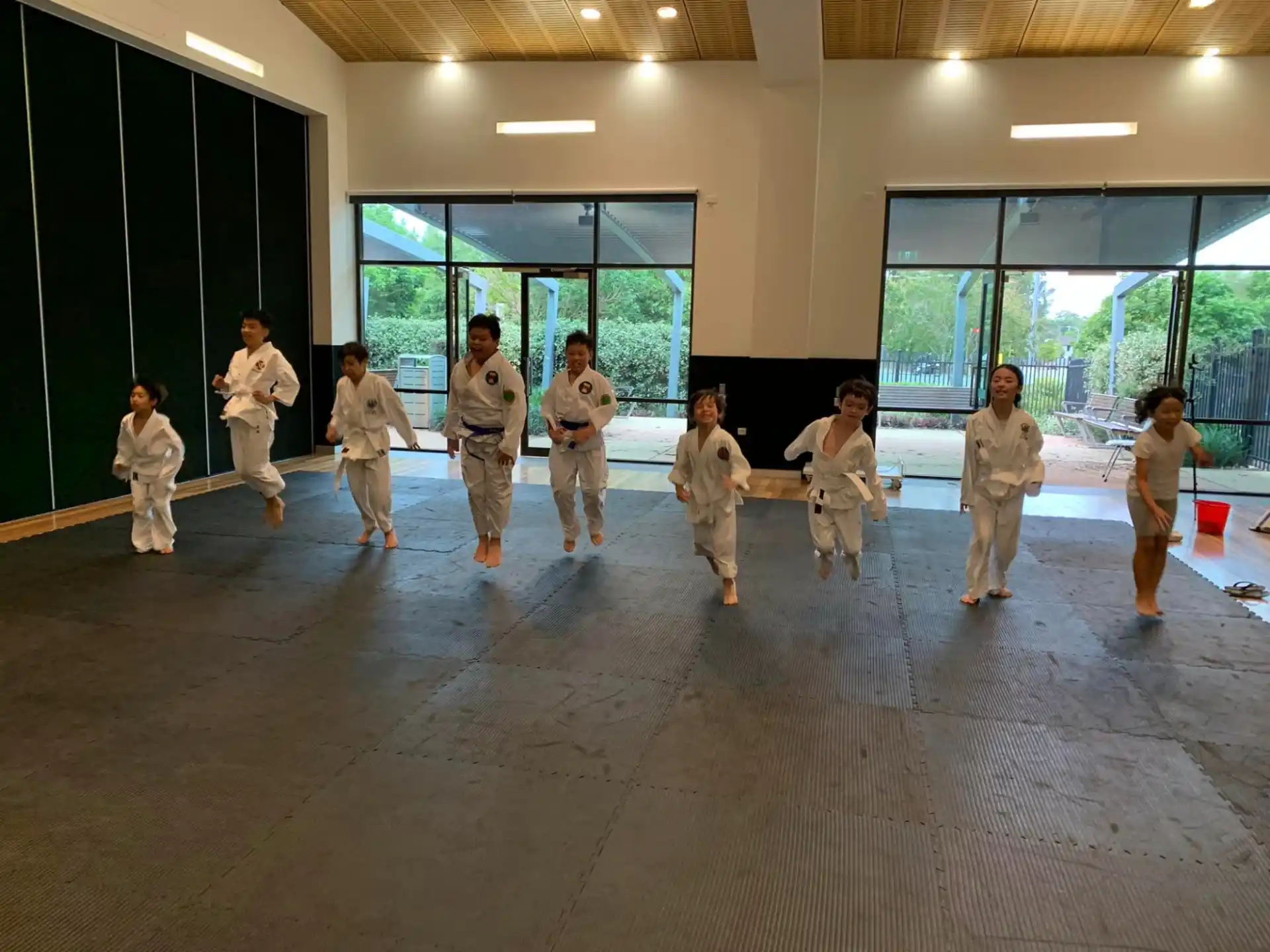 a group of people in karate uniforms