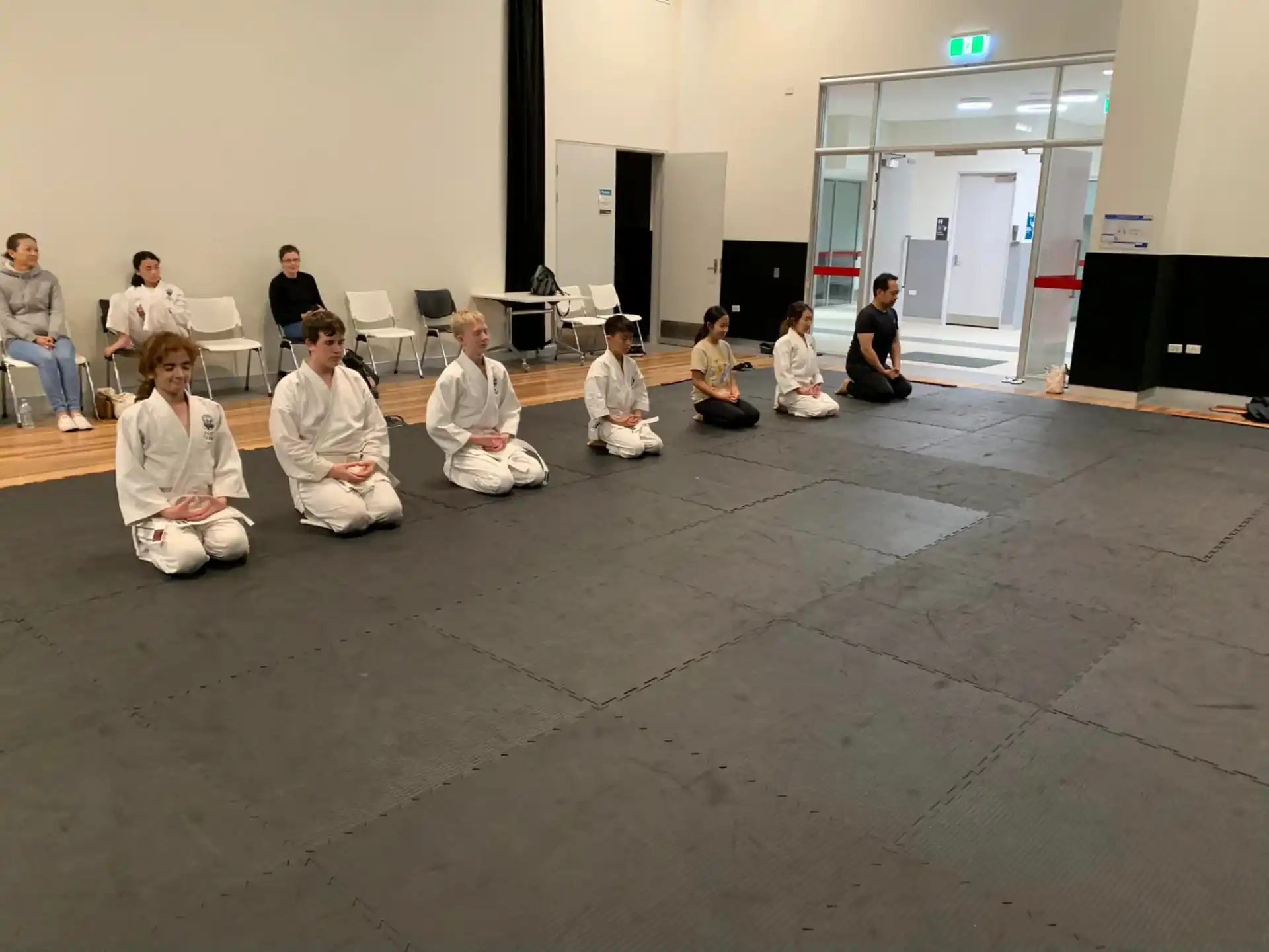 a group of people sitting on the floor