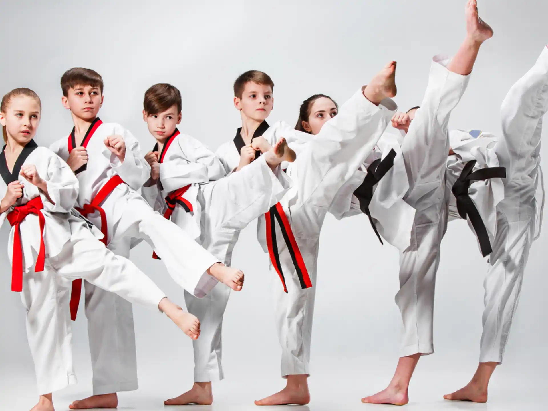 a group of men in karate uniforms