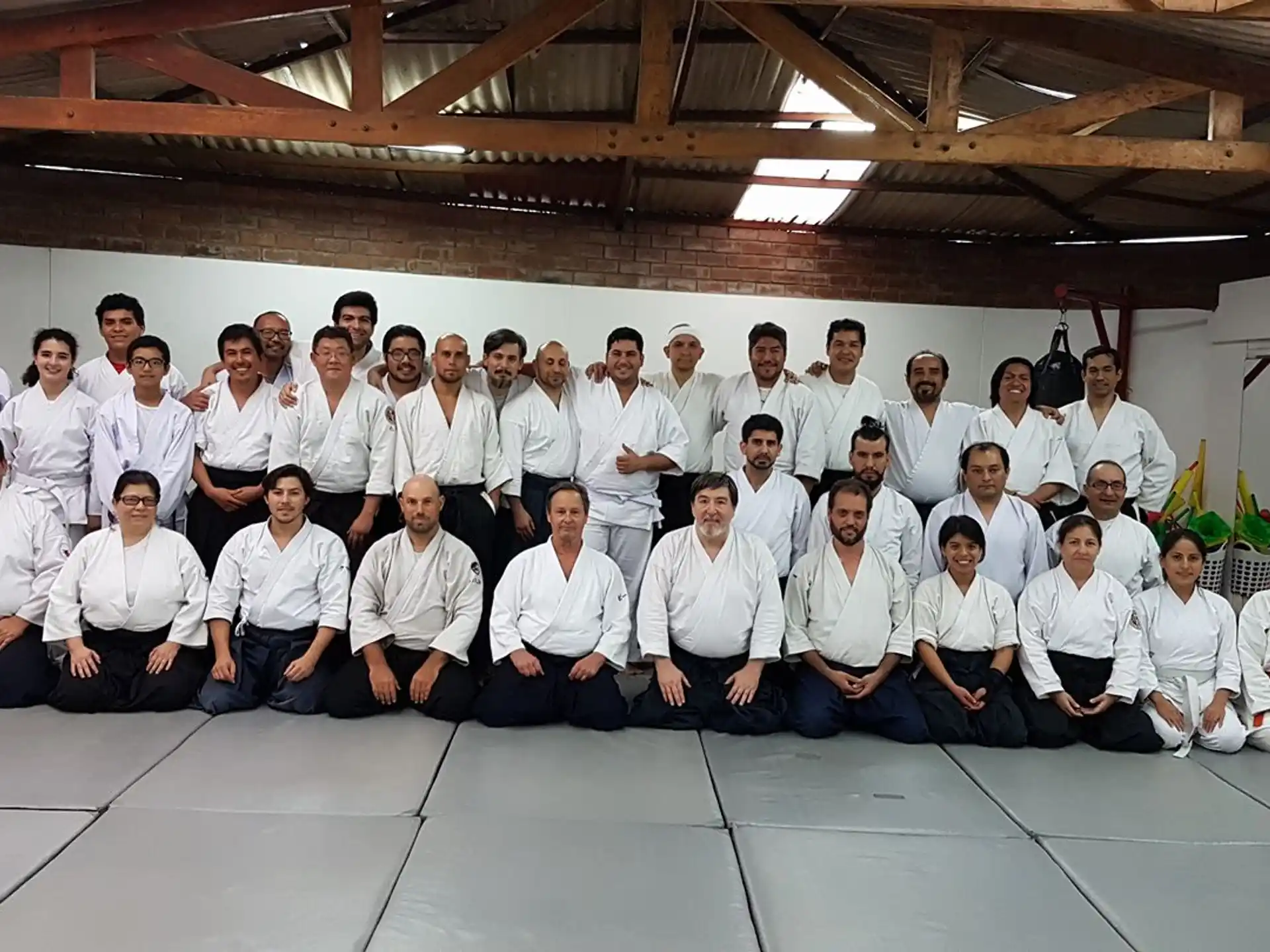 a group of people in white shirts