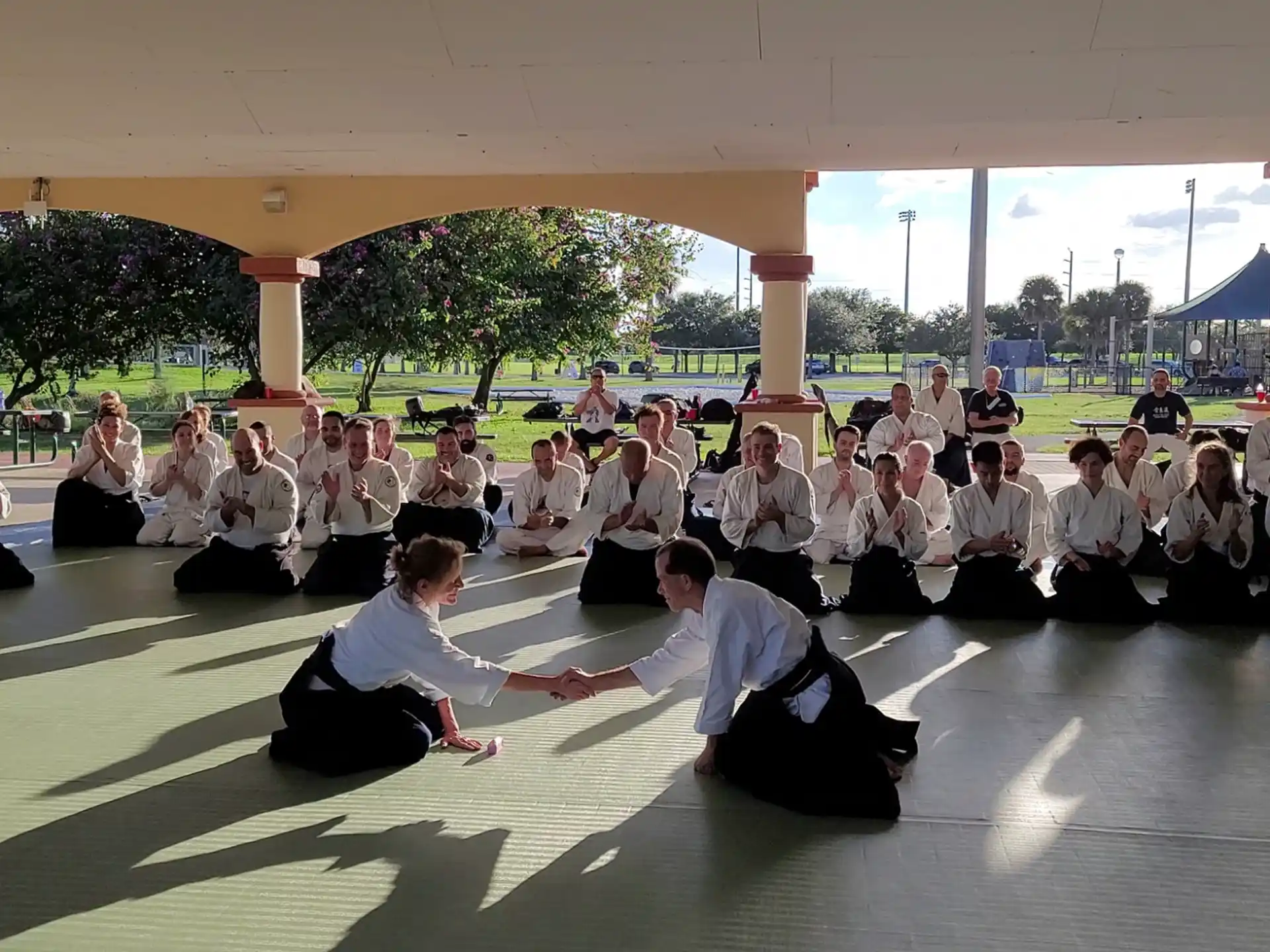 a group of people sitting together outside