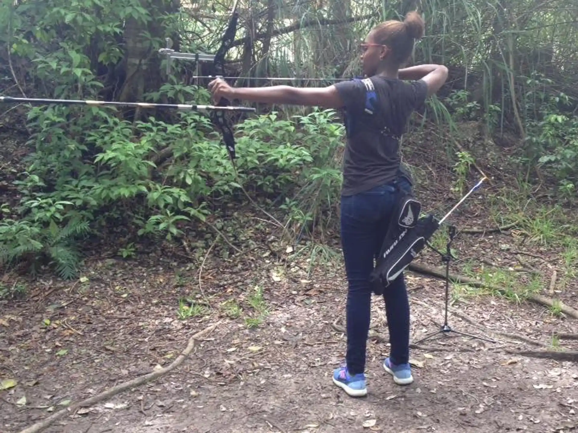 a man holding a bow and arrow