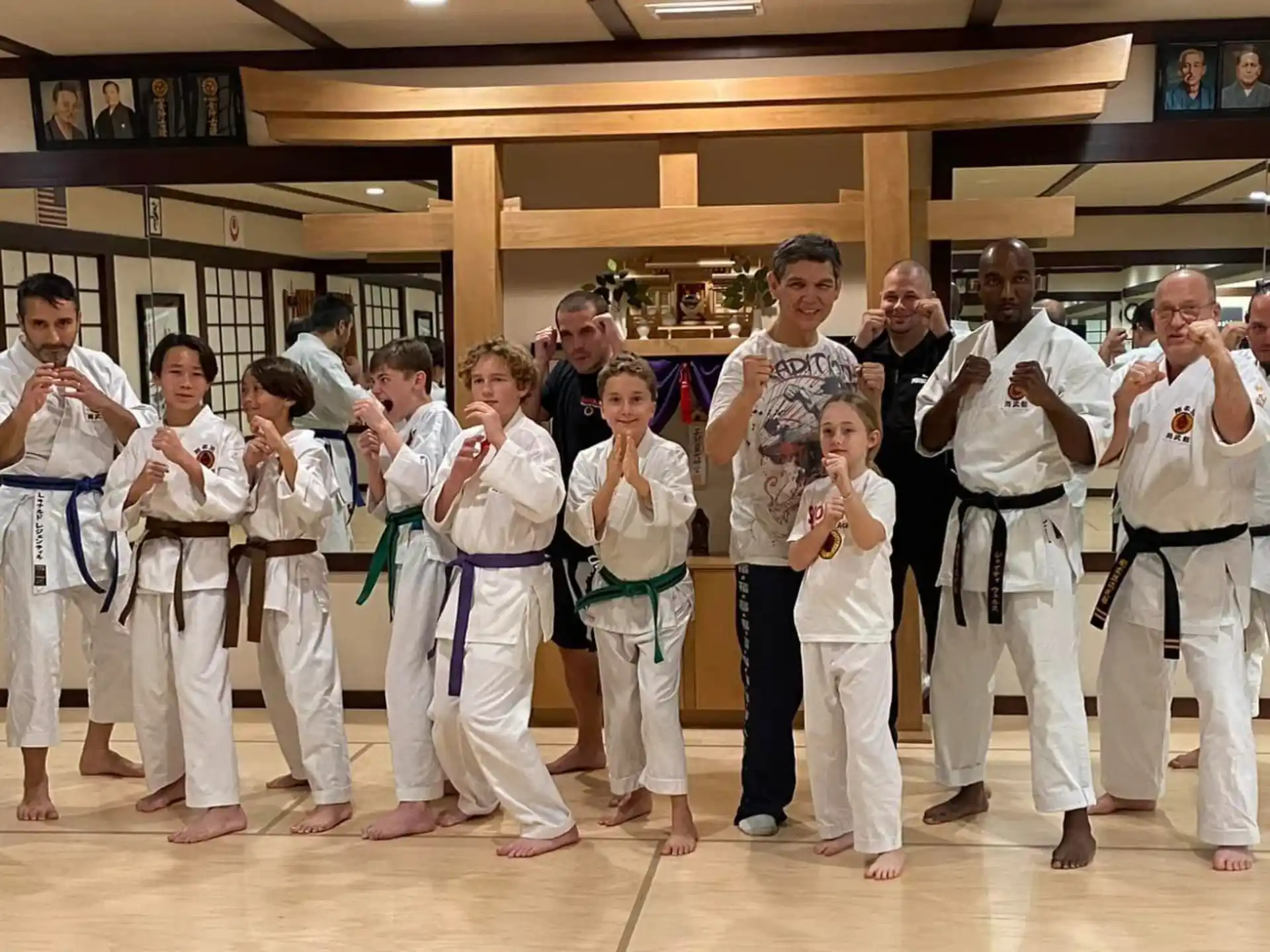 a group of people in karate uniforms
