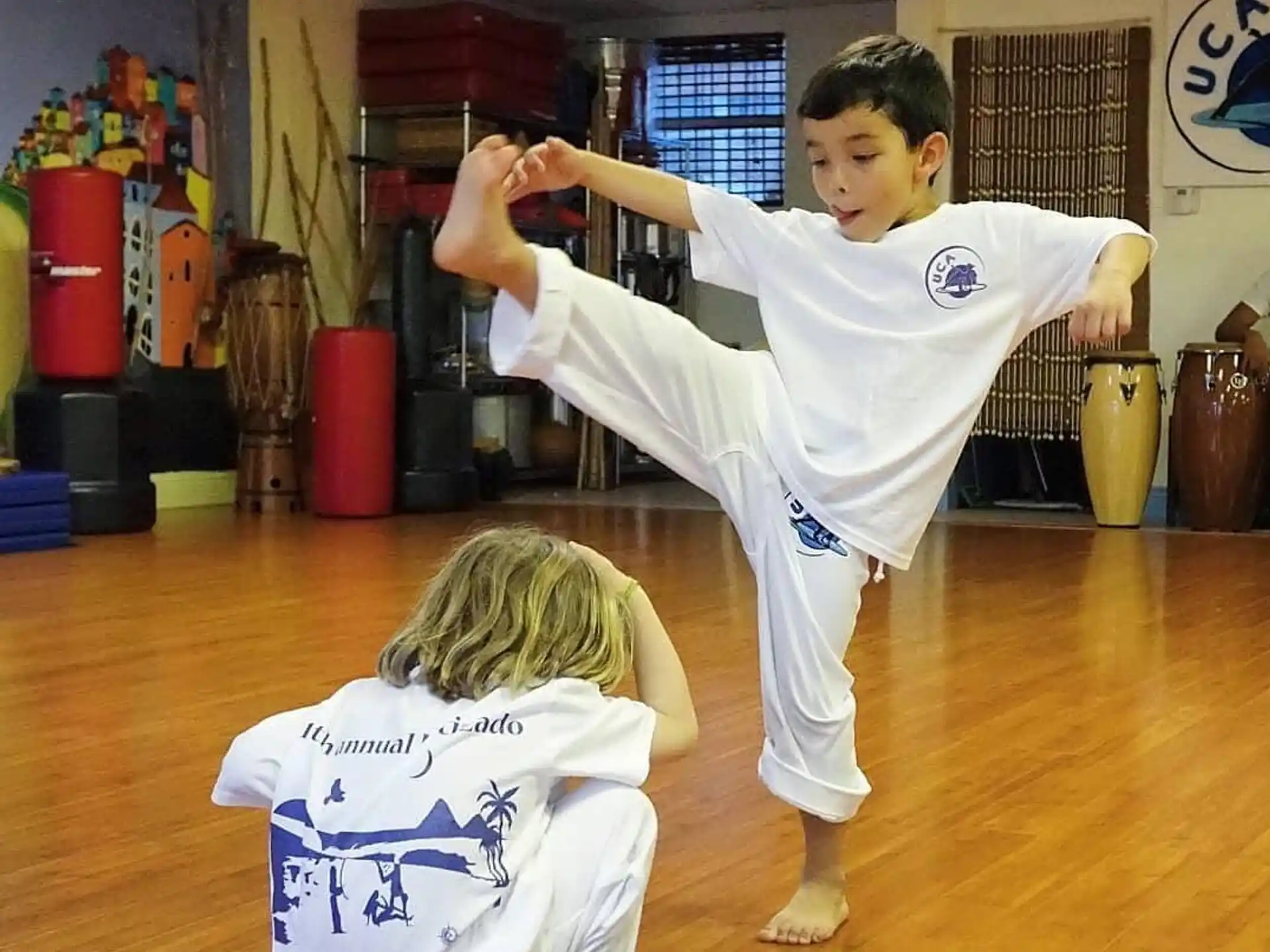a boy doing a karate move