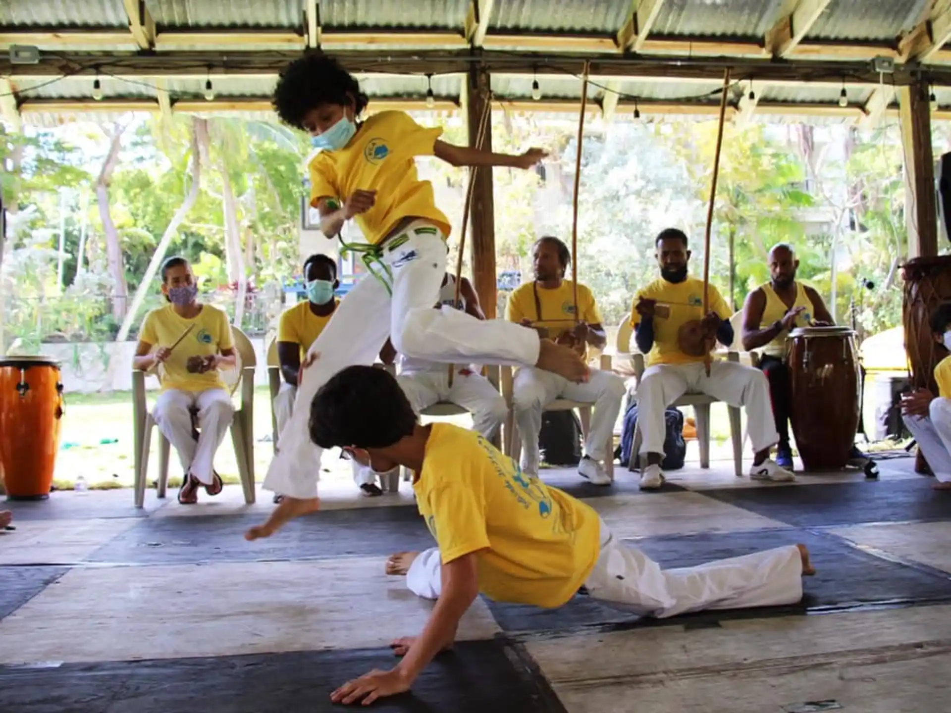 a group of people in yellow shirts