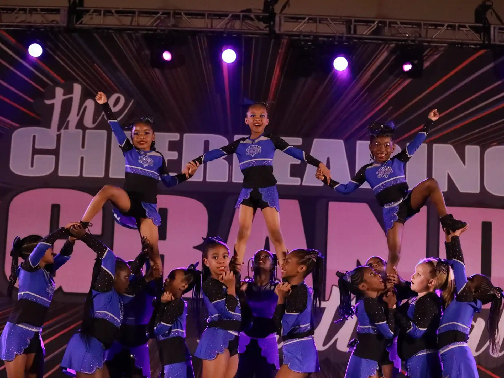 a group of cheerleaders on a stage