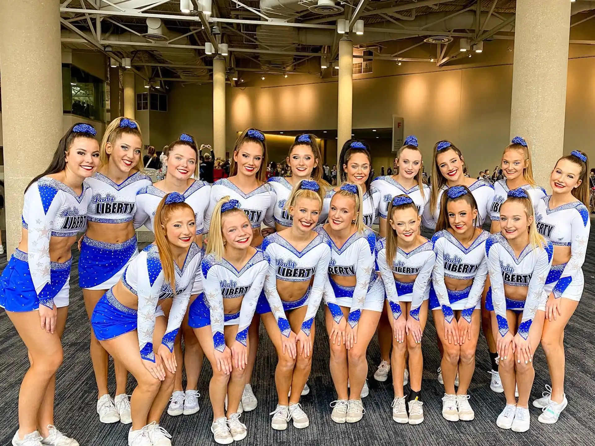 a group of cheerleaders posing for a photo