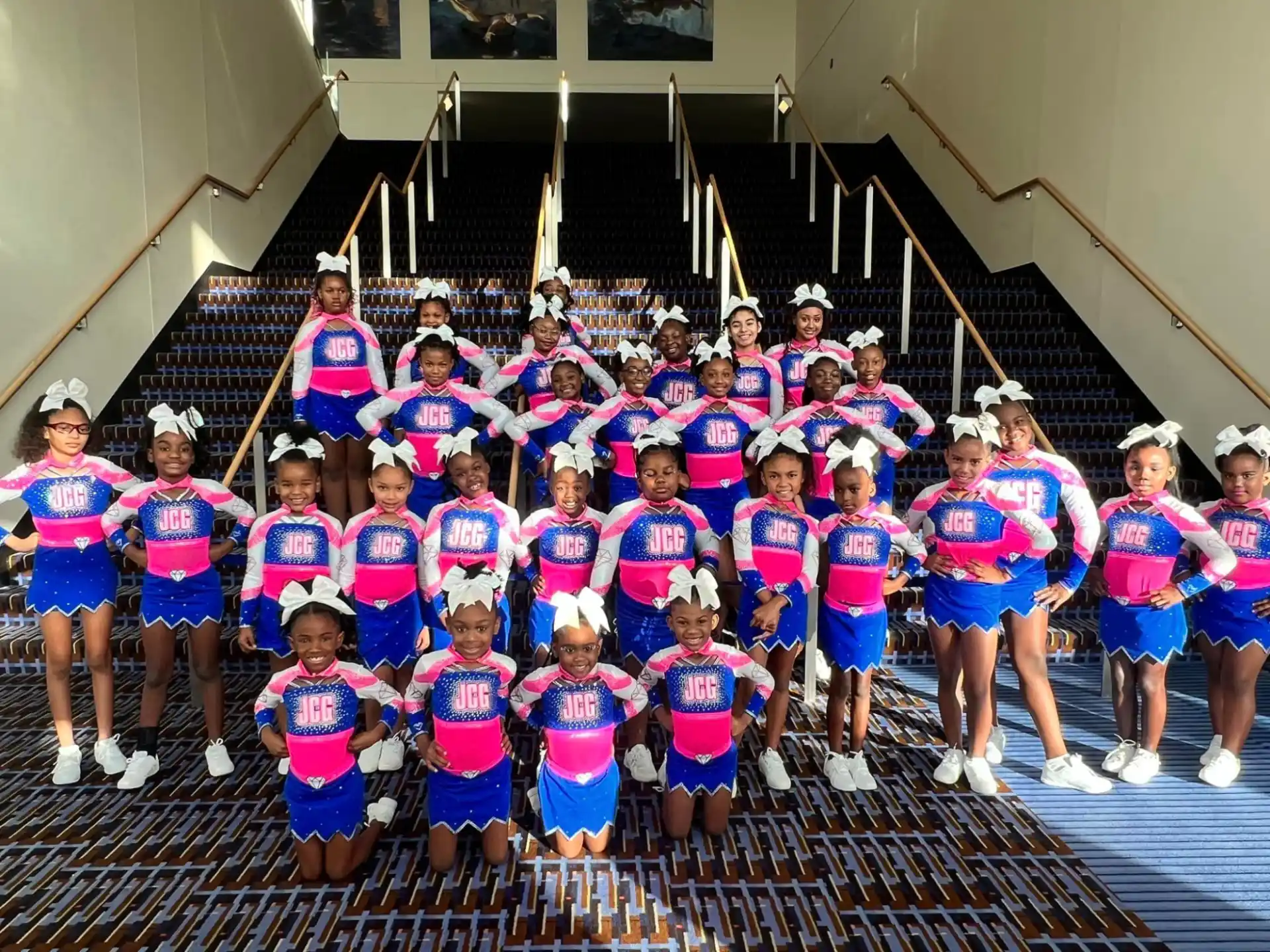 a group of girls in matching outfits