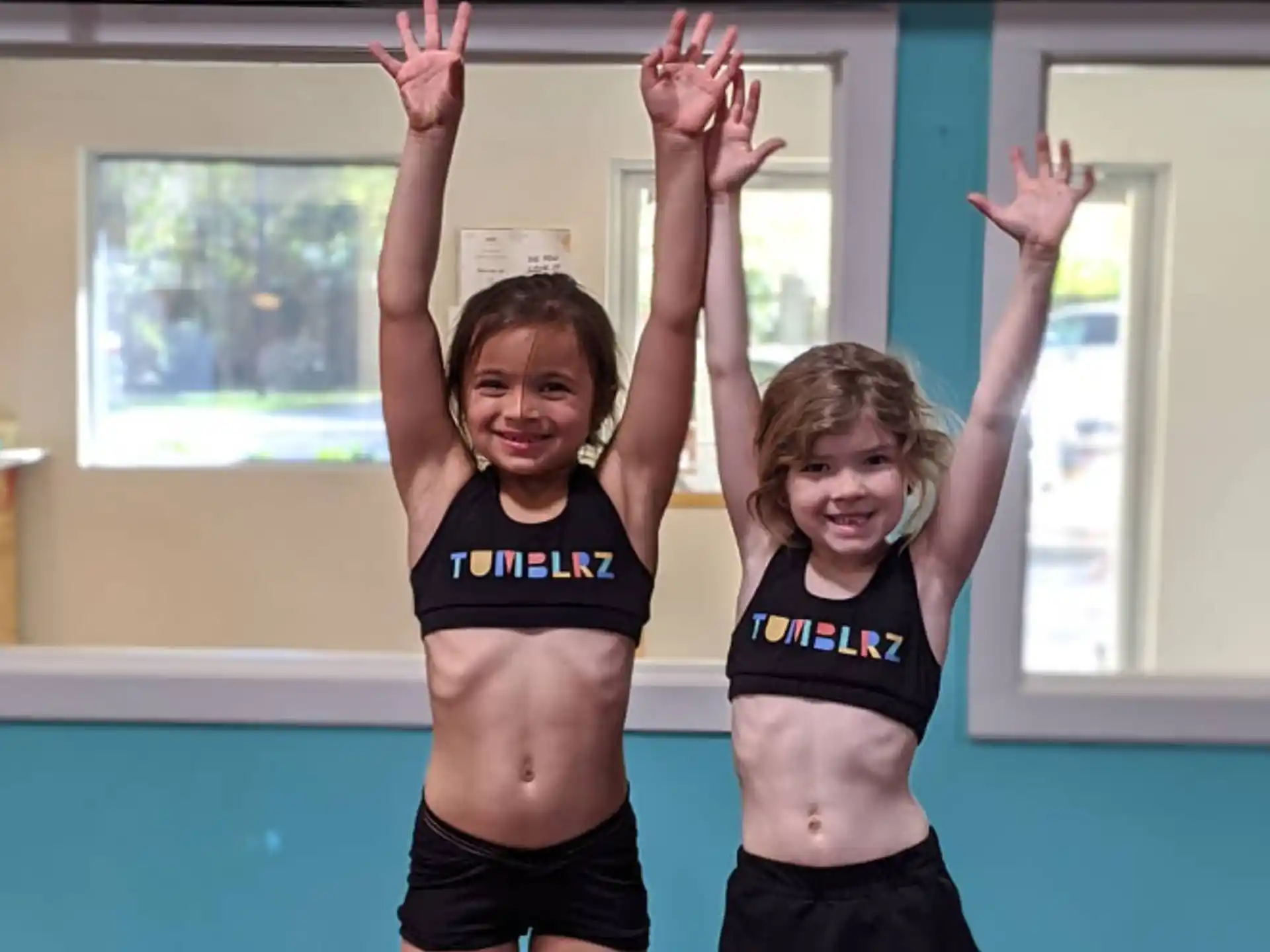 a couple of girls in a gym