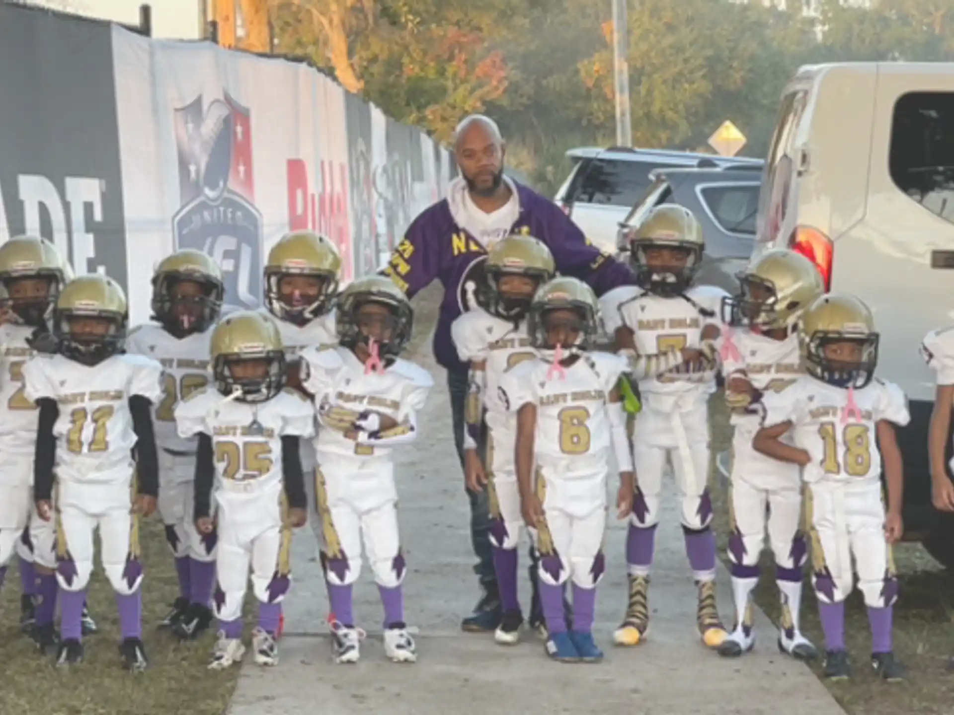 a group of kids wearing football gear