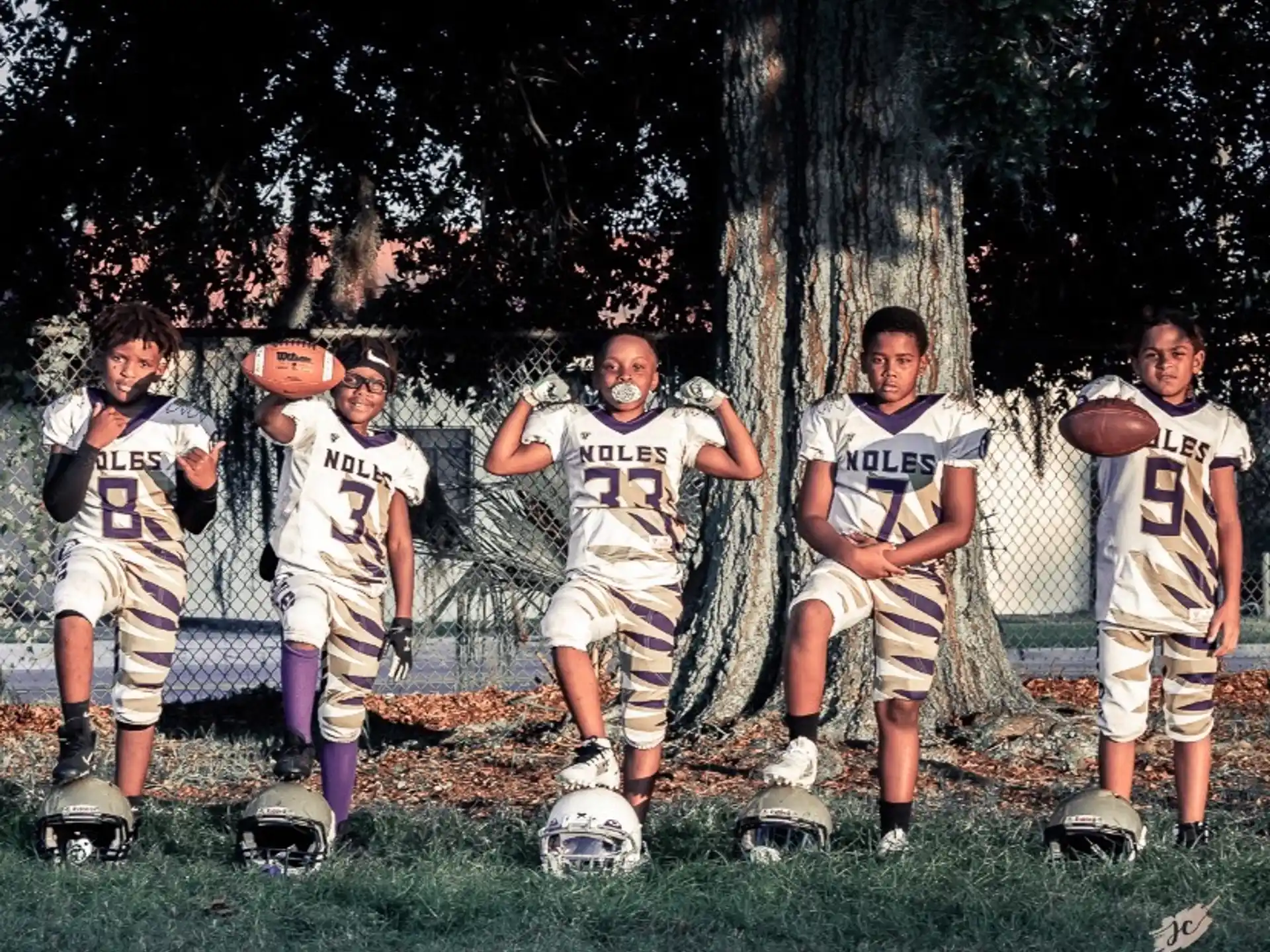 a group of men in sports uniforms