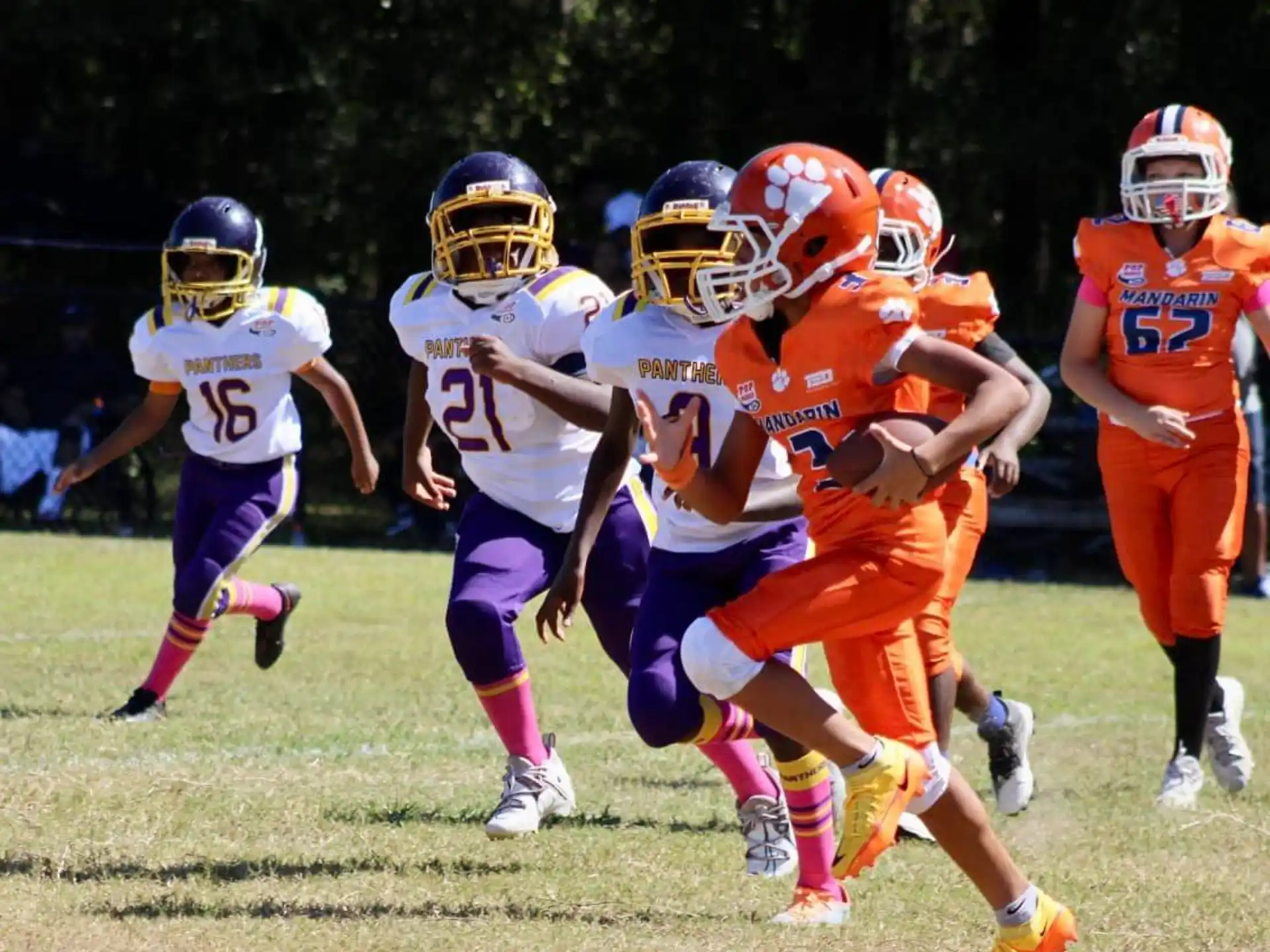 a group of kids playing football