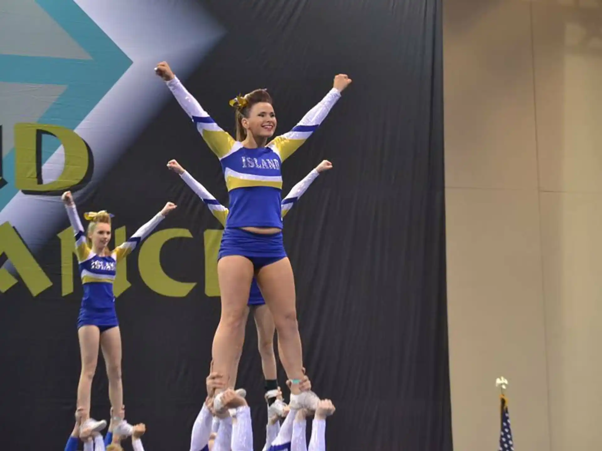 a group of cheerleaders on a stage