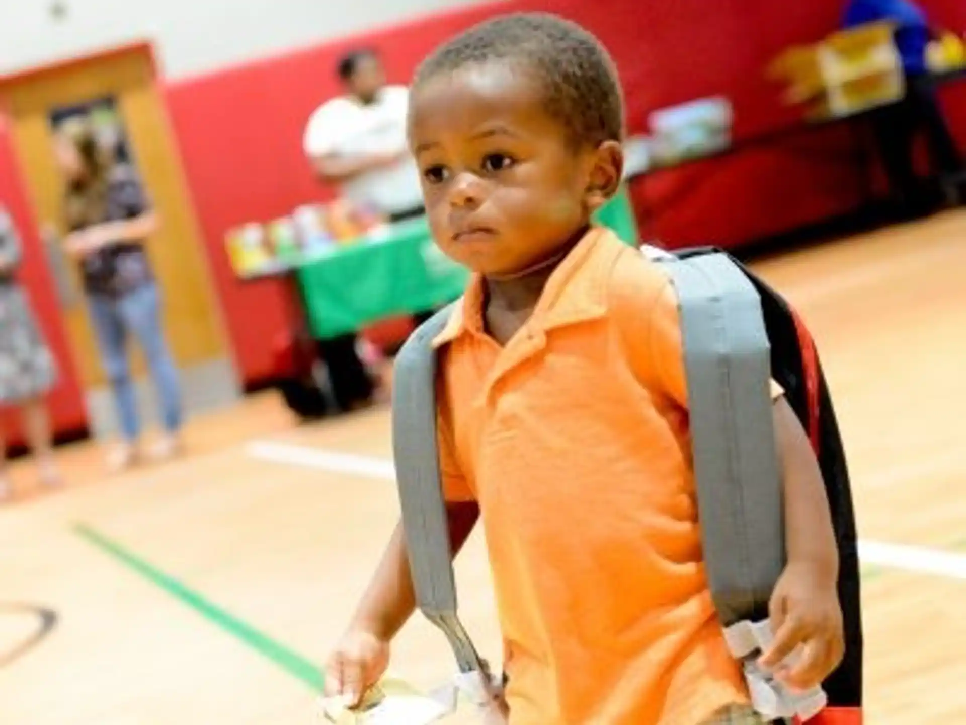 a young boy wearing a backpack