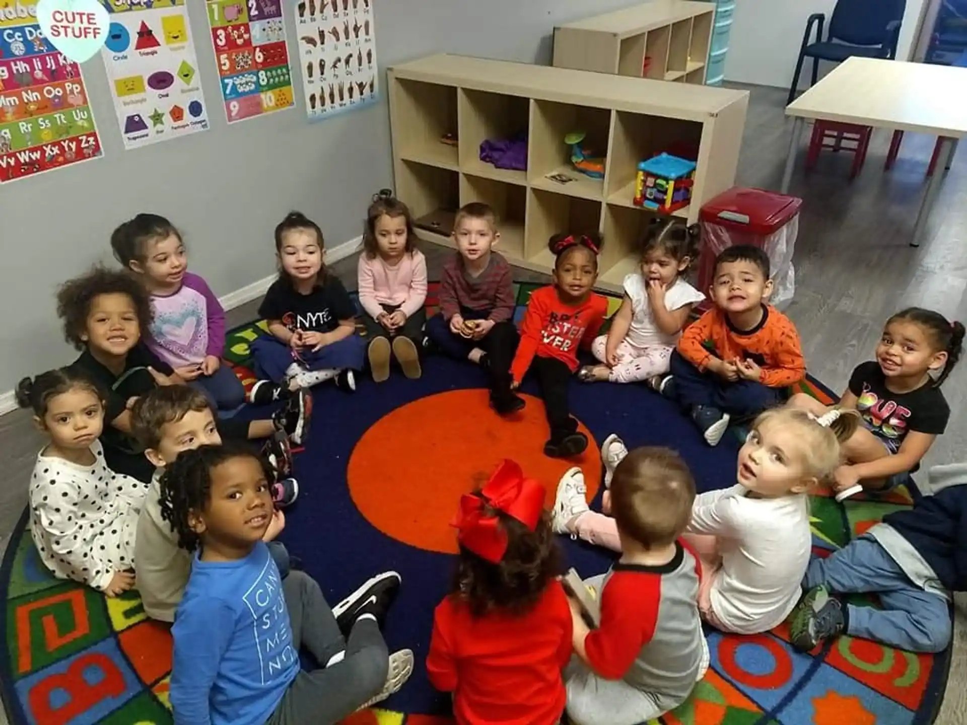 a group of children sitting on the floor