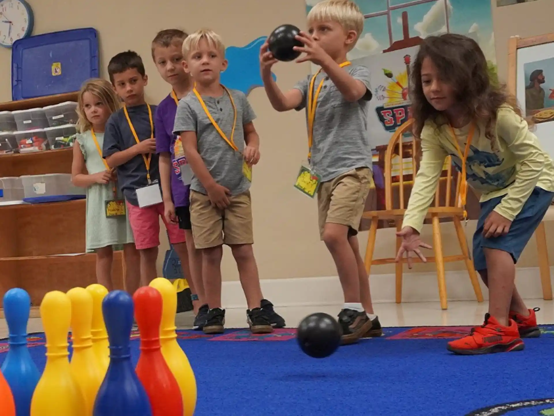 a group of children playing with balls