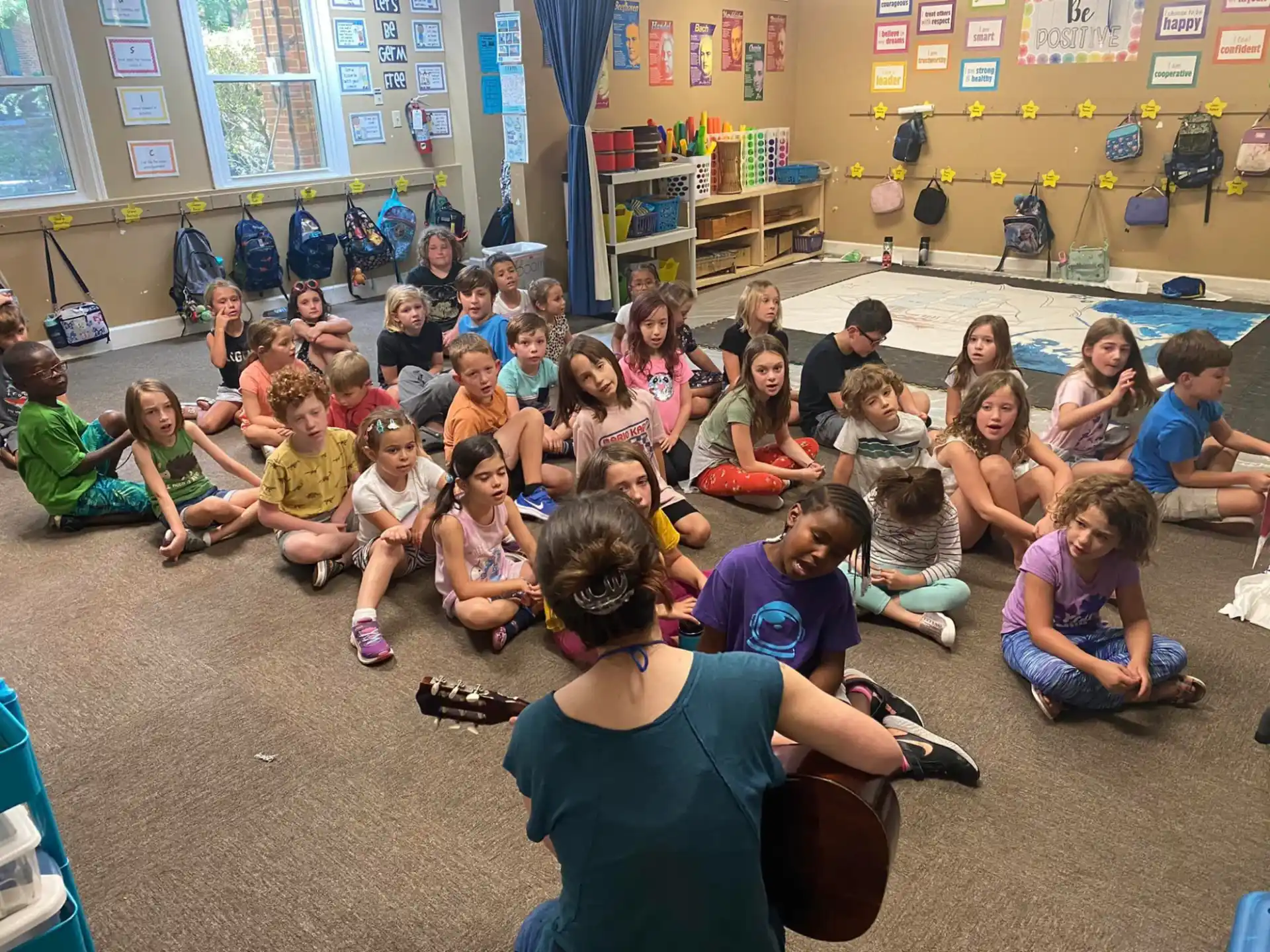 a group of children sitting on the floor