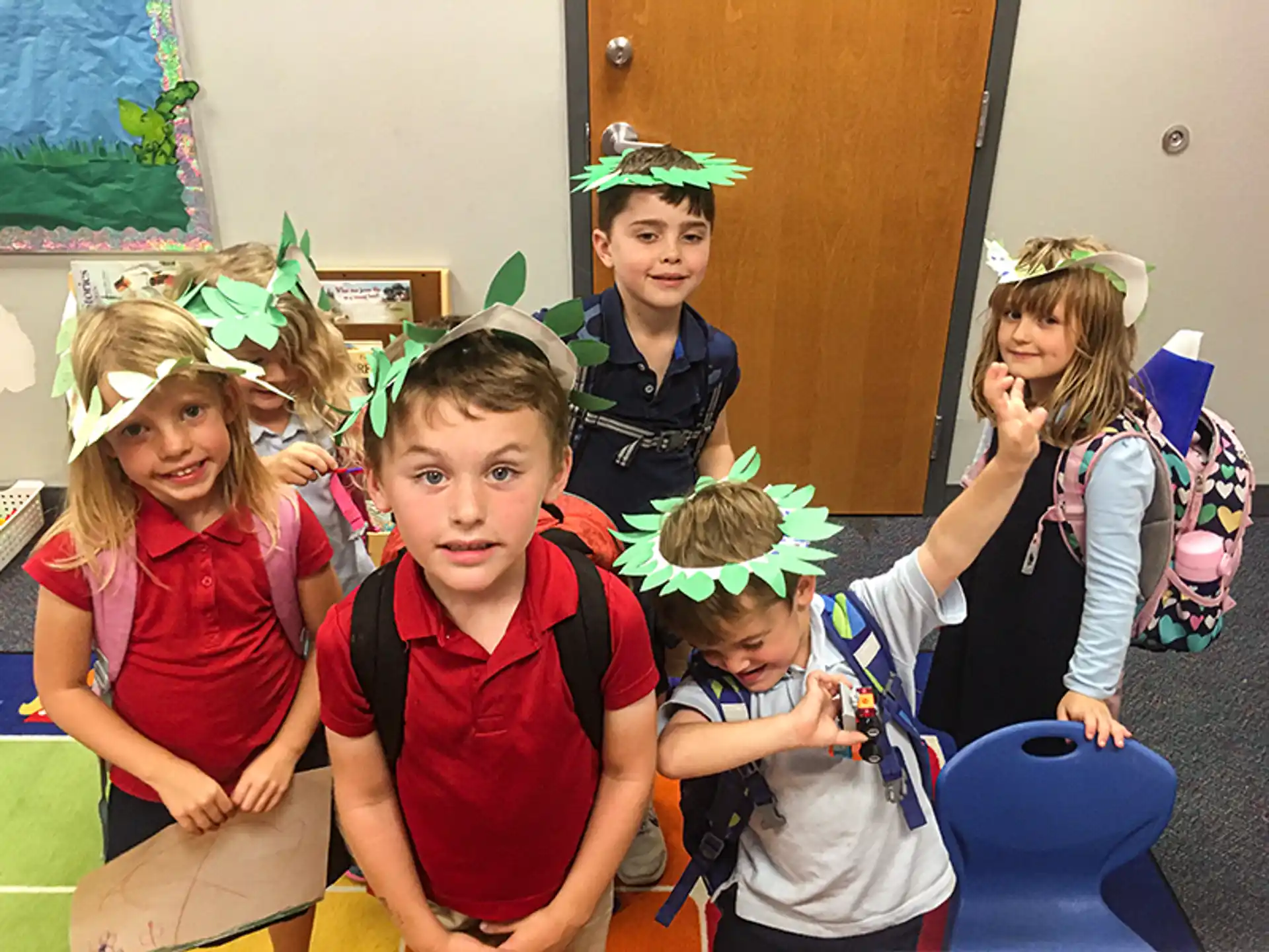 a group of children wearing party hats