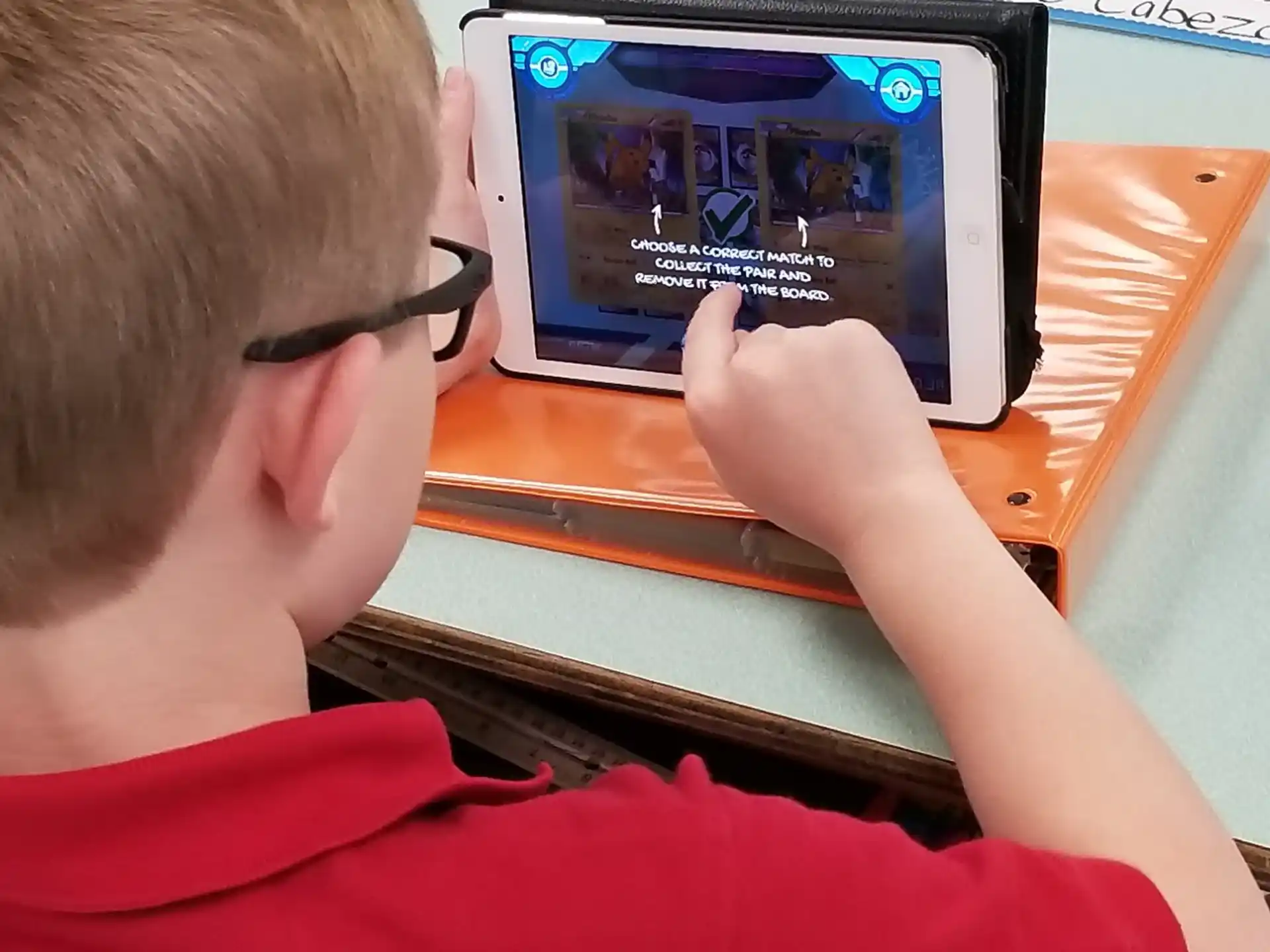a boy using a computer