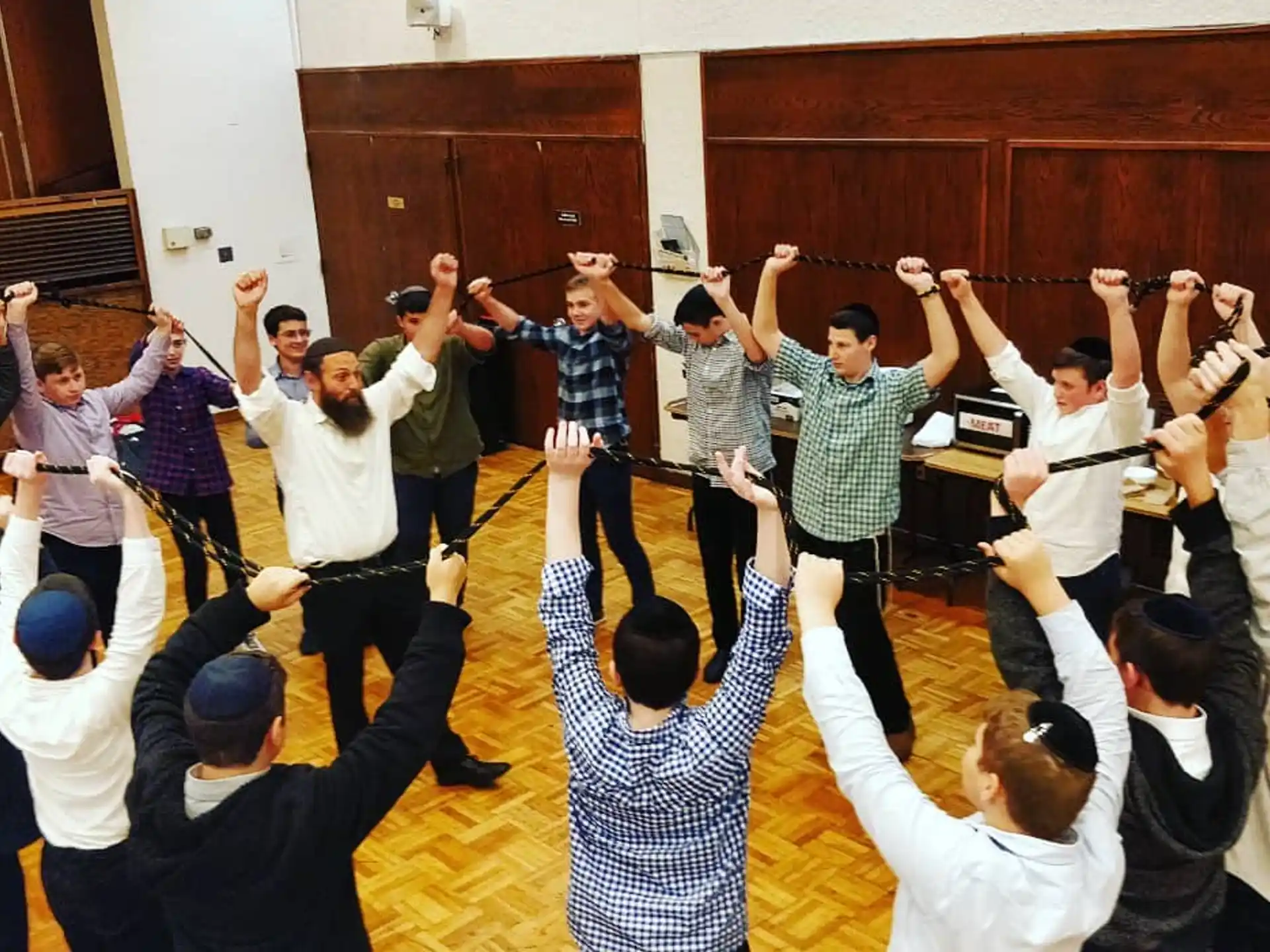 a group of people raising their hands